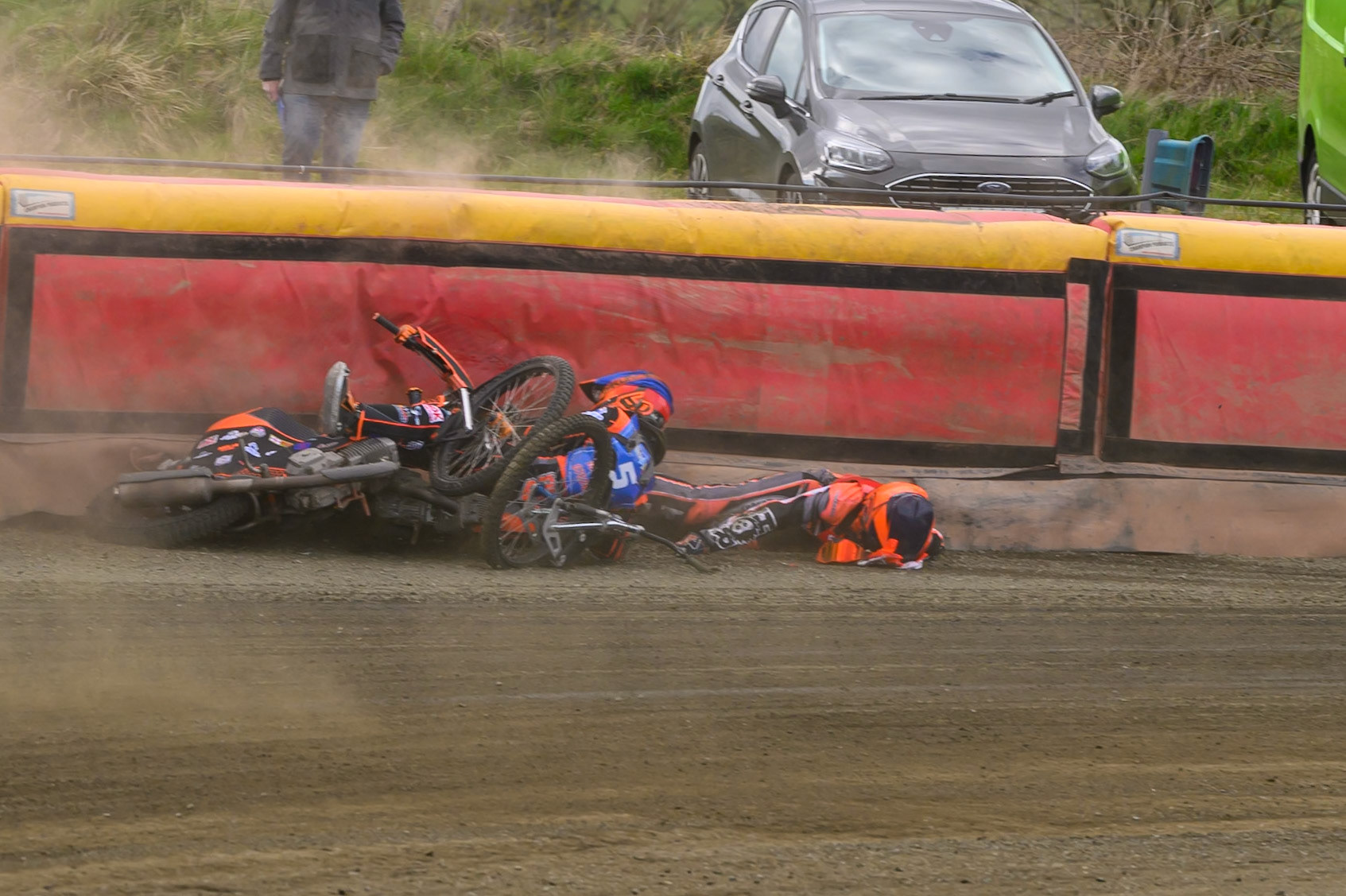 Connor Coles of NDL Nomads   in White fall and Jack Smith of Buxton Bulls   in Blue collides with him during the  Challenge match between Buxton Bulls and NDL Nomads at Hi-Edge Speedway, Buxton on Sunday 19th April 2026. (Photo: Ian Charles | MI News)