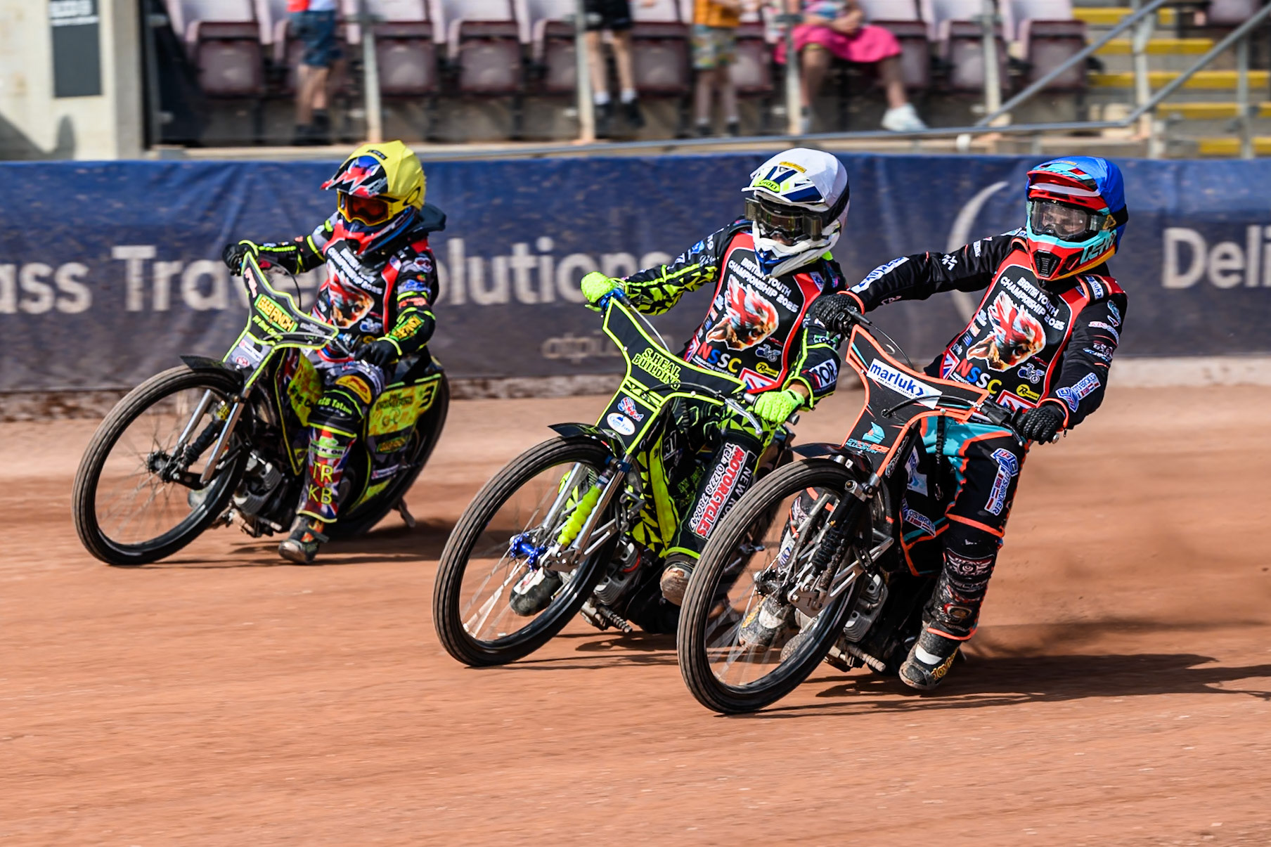 Casper Kluciniak (505) in Blue on the inside of Oli Boverton (15) in White and Archie Rolph (3) in Yellow during the British Youth Speedway Championship at the National Speedway Stadium, Manchester on Sunday 10th August 2025. (Photo: Ian Charles | MI News)
