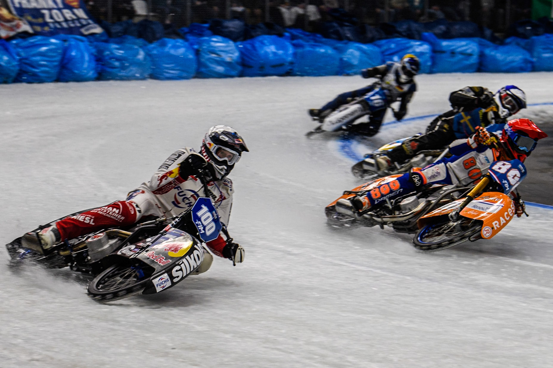 Franky Zorn (100) of Austria in White rides outside Jasper Iwema (800) of The Netherlands in Red, Jimmy Olsén (81) of Sweden in Blue with Wild Card Reinhard Greisel (16) of Germany in Yellow behind during the Ice Speedway Gladiators World Championship Final 2 at Max-Aicher-Arena, Inzell on Sunday 16th March 2025. (Photo: Ian Charles | MI News)