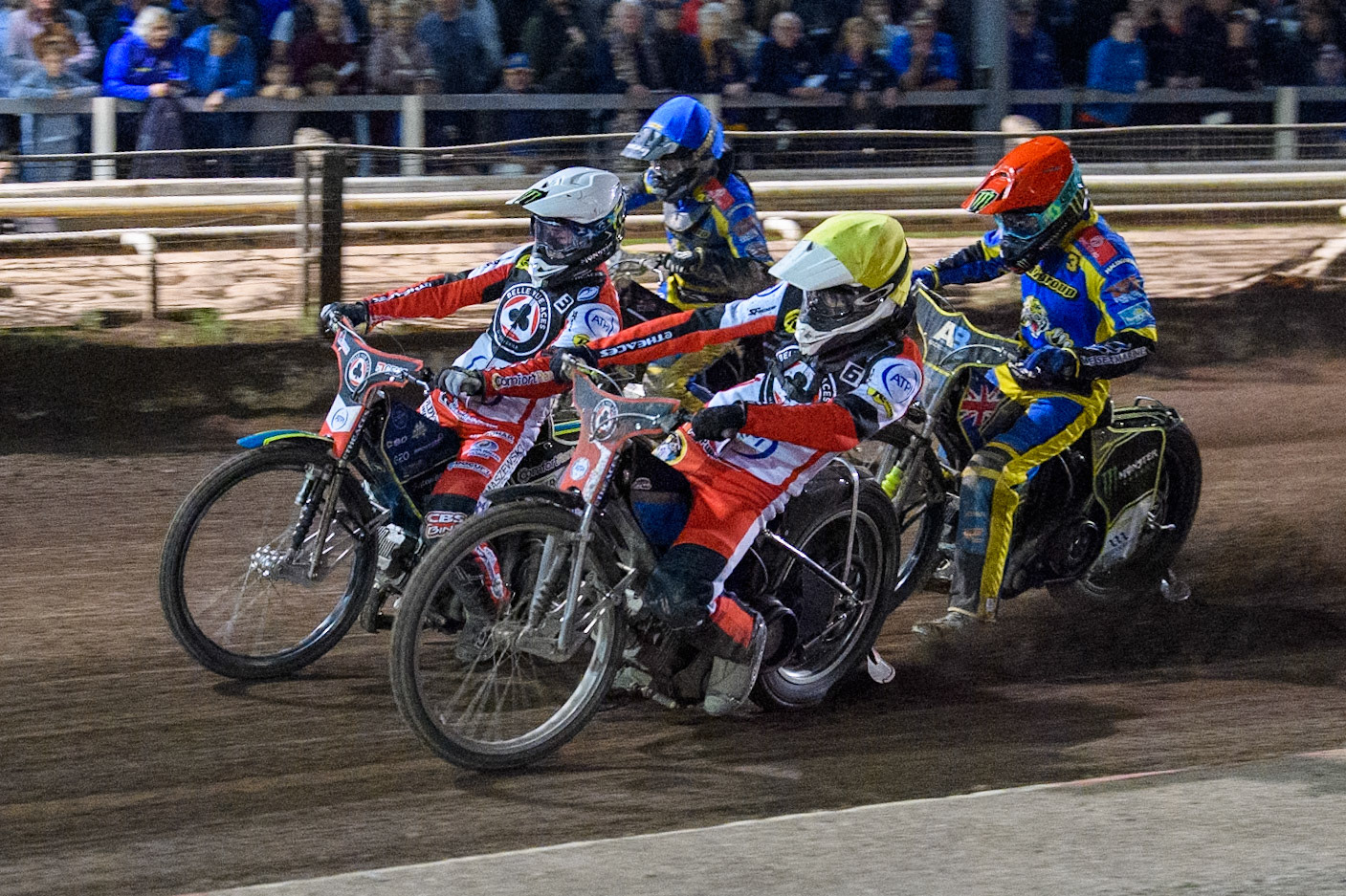 \Belle Vue Aces' Antti Vuolas  in Yellow and Belle Vue Aces' Jaimon Lidsey  in White go for maximum points ahead Sheffield Tigers' Chris Holder  in Red and Sheffield Tigers' Dan Gilkes  in Blue during the Rowe Motor Oil Premiership Play Off Semi Final 2nd leg between Sheffield Tigers and Belle Vue Aces at Owlerton Stadium, Sheffield on Thursday 19th September 2024. (Photo: Ian Charles | MI News)