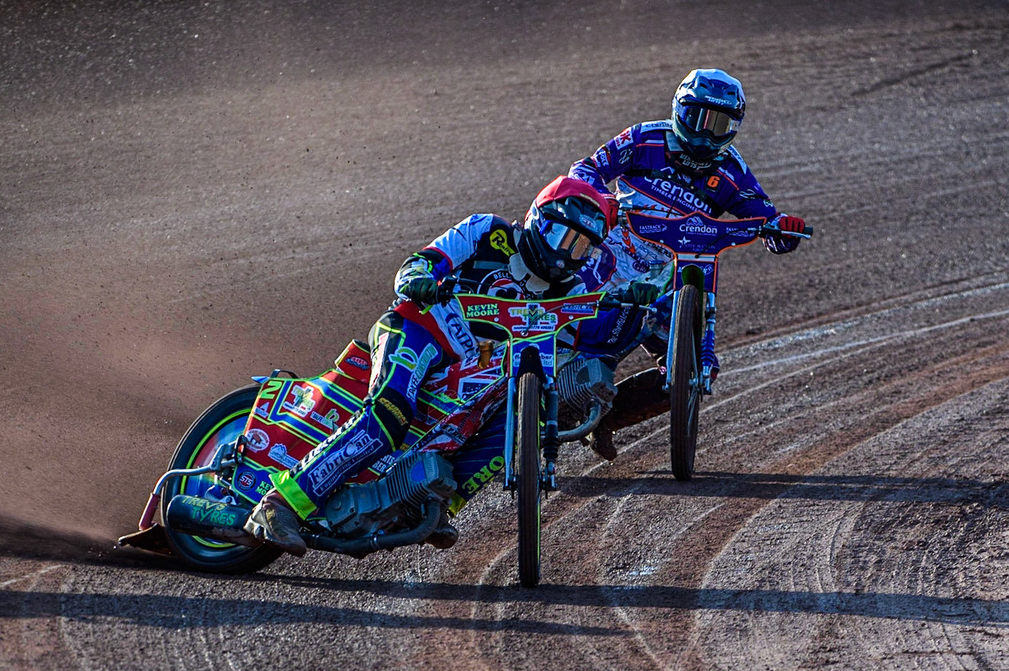 Simon Lambert (Red) leads Hans Andersen (White) during the Sports Insure Premiership match between Belle Vue Aces and Peterborough at the National Speedway Stadium, Manchester on Monday 19th June 2023. (Photo: Ian Charles | MI News)