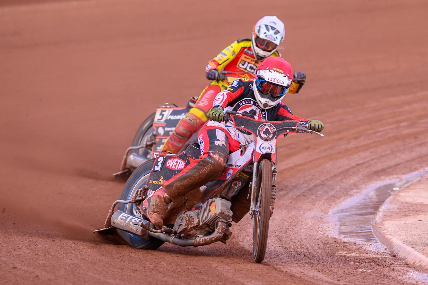Peter Kildemand of Belle Vue Aces in Red leading Sam Masters of Leicester Lions in White during the Rowe Motor Oil Premiership match between Belle Vue Aces and Leicester Lions at the National Speedway Stadium, Manchester on Monday 3rd August 2026. (Photo: Ian Charles | MI News)