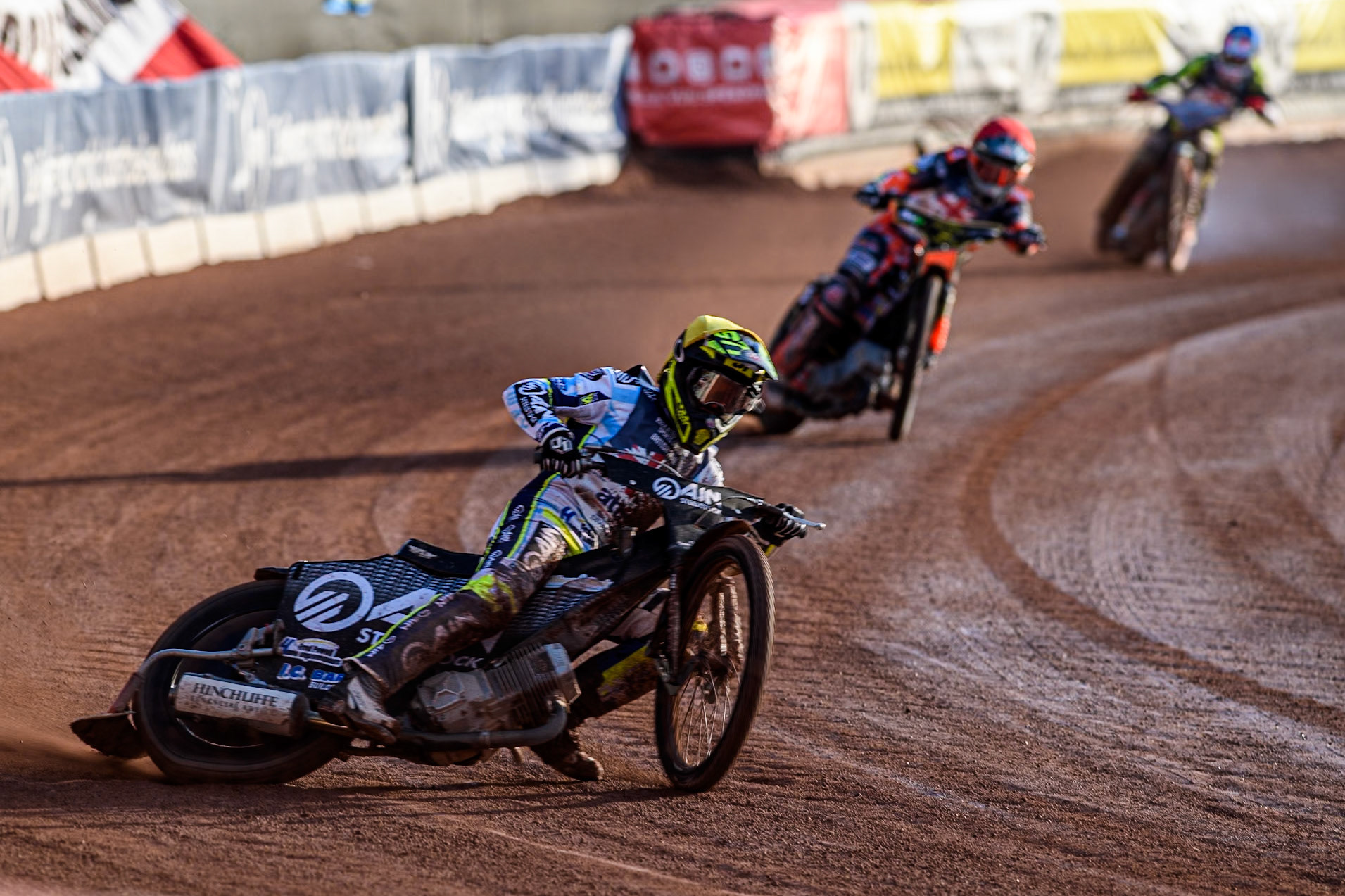 Lewis Kerr in Yellow leading Jordan Jenkins in Red and Drew Kemp in Blue during the Attis Insurance Sports Division British Speedway Championship Final at the National Speedway Stadium, Manchester on Saturday 8th June 2024. (Photo: Ian Charles | MI News)