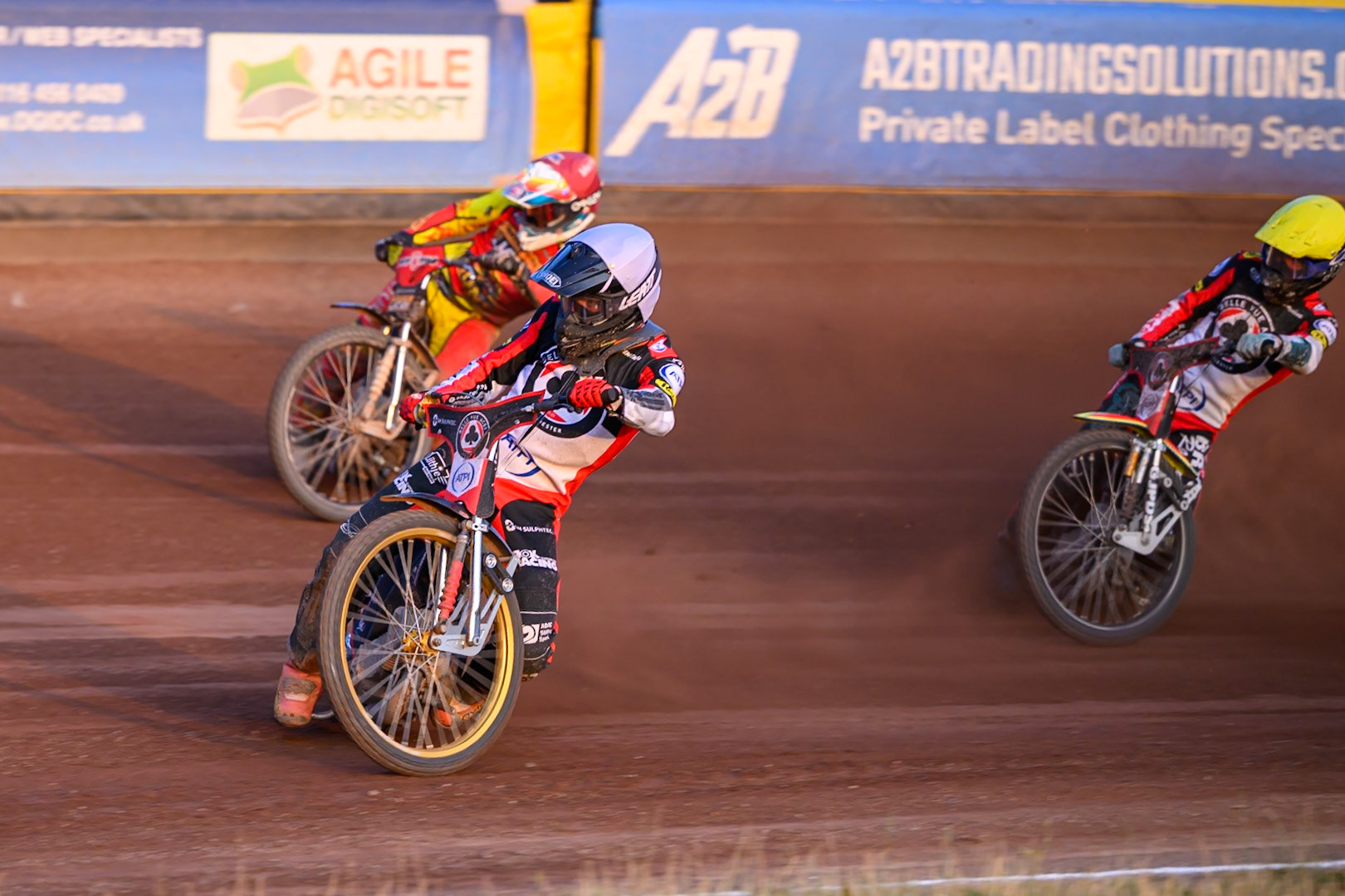 Norick Blodorn of Belle Vue Aces  in White rides inside Nick Morris of Leicester Lions in Red  with Will Cairns of Belle Vue Aces in Yellow behind during the Rowe Motor Oil Premiership match between Leicester Lions and Belle Vue Aces at the Hydroscan Arena, Leicester on Thursday 23rd July 2026. (Photo: Ian Charles | MI News)