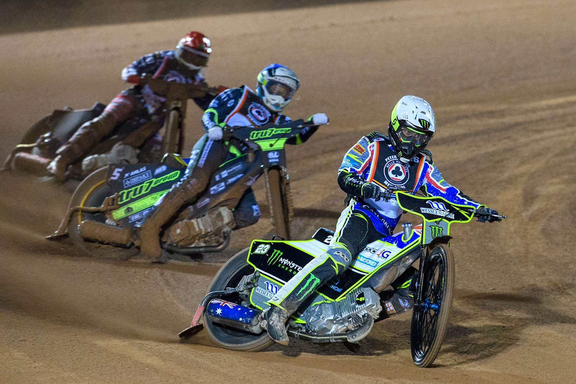 Chris Holder in White leading Jason Doyle in Blue and Freddie Lindgren in Red during the Peter Craven Memorial Trophy at the National Speedway Stadium, Manchester on Monday 17th March 2025. (Photo: Ian Charles | MI News)