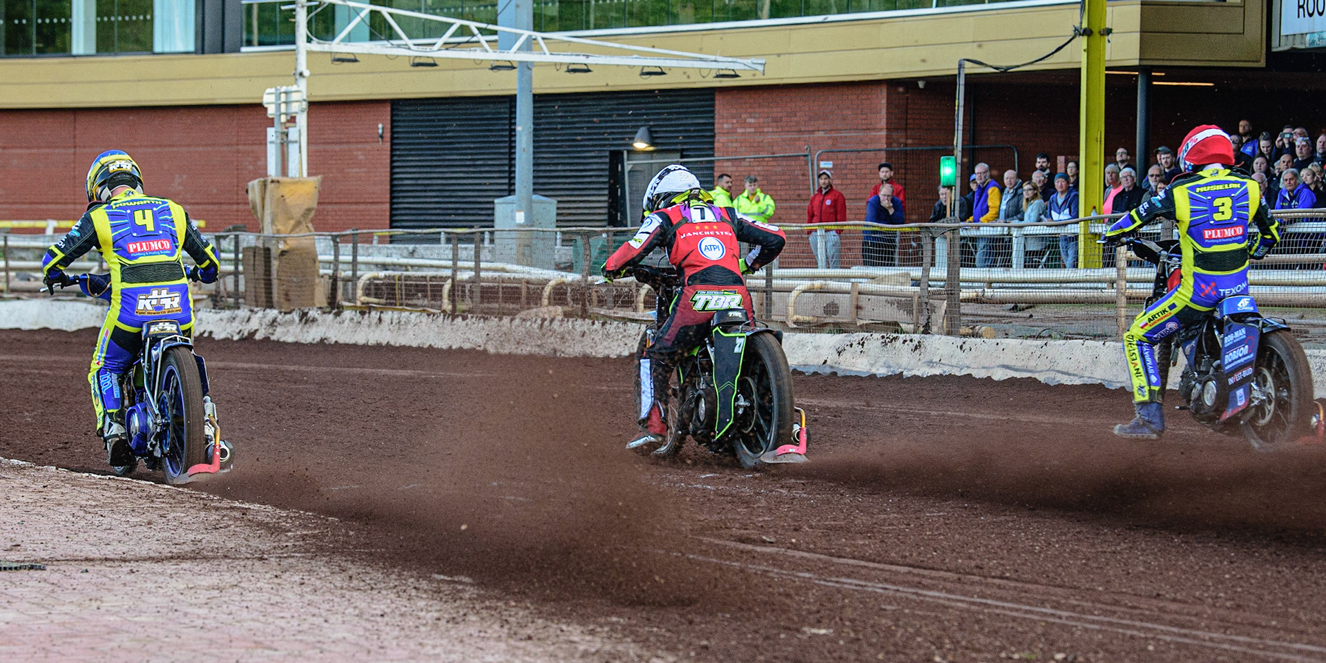 SHEFFIELD, UK. MAY 26TH  Kyle Howarth  (Blue), Tom Brennan  (White) and Tobiasz Musielak  (Red) leave the startline  during the SGB Premiership match between Sheffield Tigers and Belle Vue Aces at Owlerton Stadium, Sheffield on Thursday 26th May 2022. (Credit: Ian Charles | MI News)