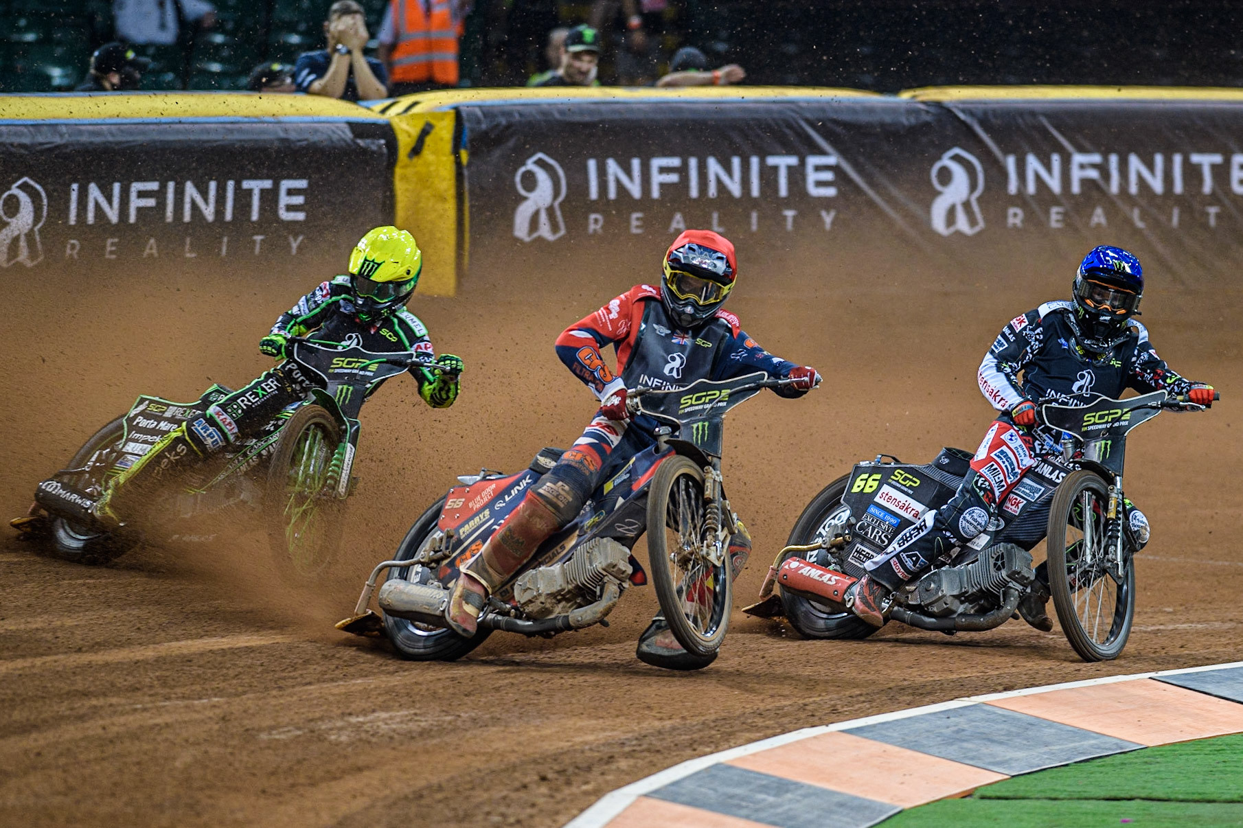Steve Worrall (16) (Red) picks up some drive ahead of Freddie Lindgren (66) (Blue) and Patryk Dudek (692) (Yellow) during the FIM Speedway Grand Prix of Great Britain at the Principality Stadium, Cardiff on Saturday 2nd September 2023. (Photo: Ian Charles | MI News)