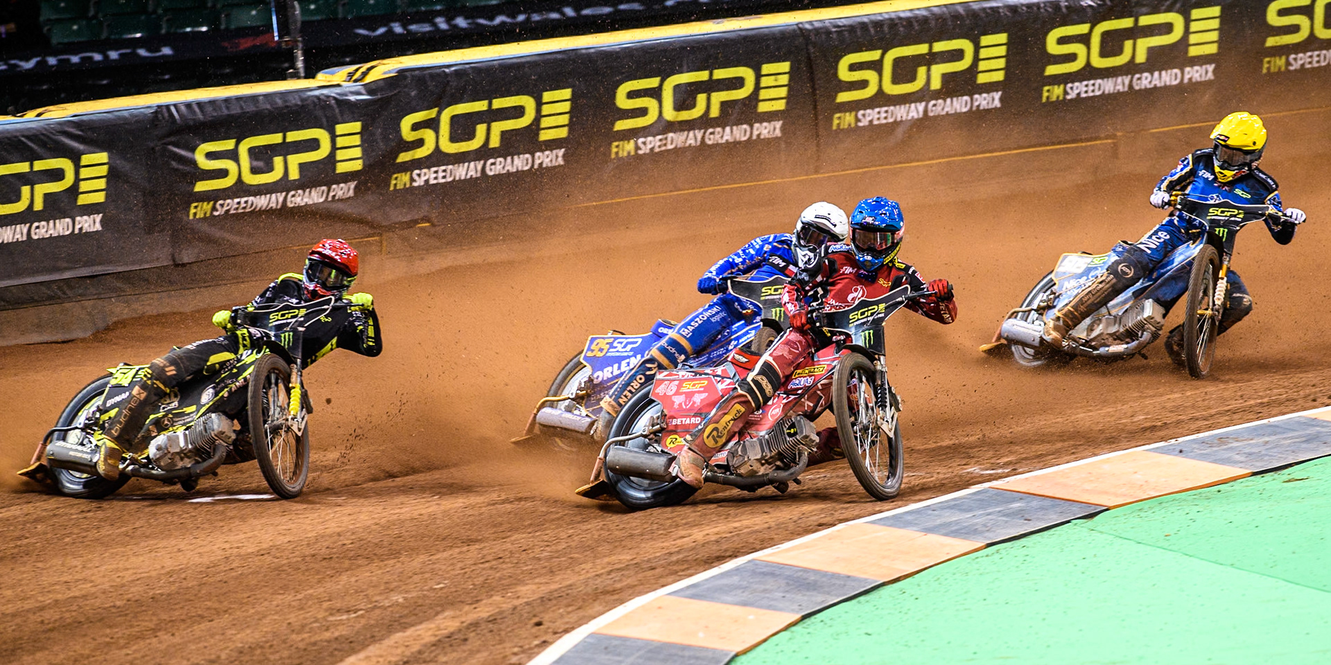 Max Fricke (46) of Australia in Blue leading Martin Vaculik (54) of Slovakia in Red Bartosz Zmarzlik (95) of Poland  in White and Robert Lambert (505) of Great Britain in Yellow during the FIM Speedway Grand Prix of Great Britain at The Principality Stadium, Cardiff on Saturday 17th August 2024. (Photo: Ian Charles | MI News)