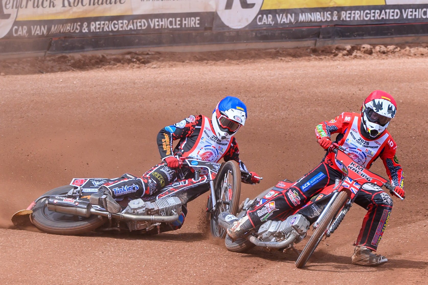 BRITISH YOUTH CHAMPIONSHIP (500cc): Kayden Mundy (8) in Red rides inside Dylan Huthwaite (9)  in Blue who then falls during the British Youth Speedway Championship at the National Speedway Stadium, Manchester on Sunday 10th May 2026. (Photo: Ian Charles | MI News)