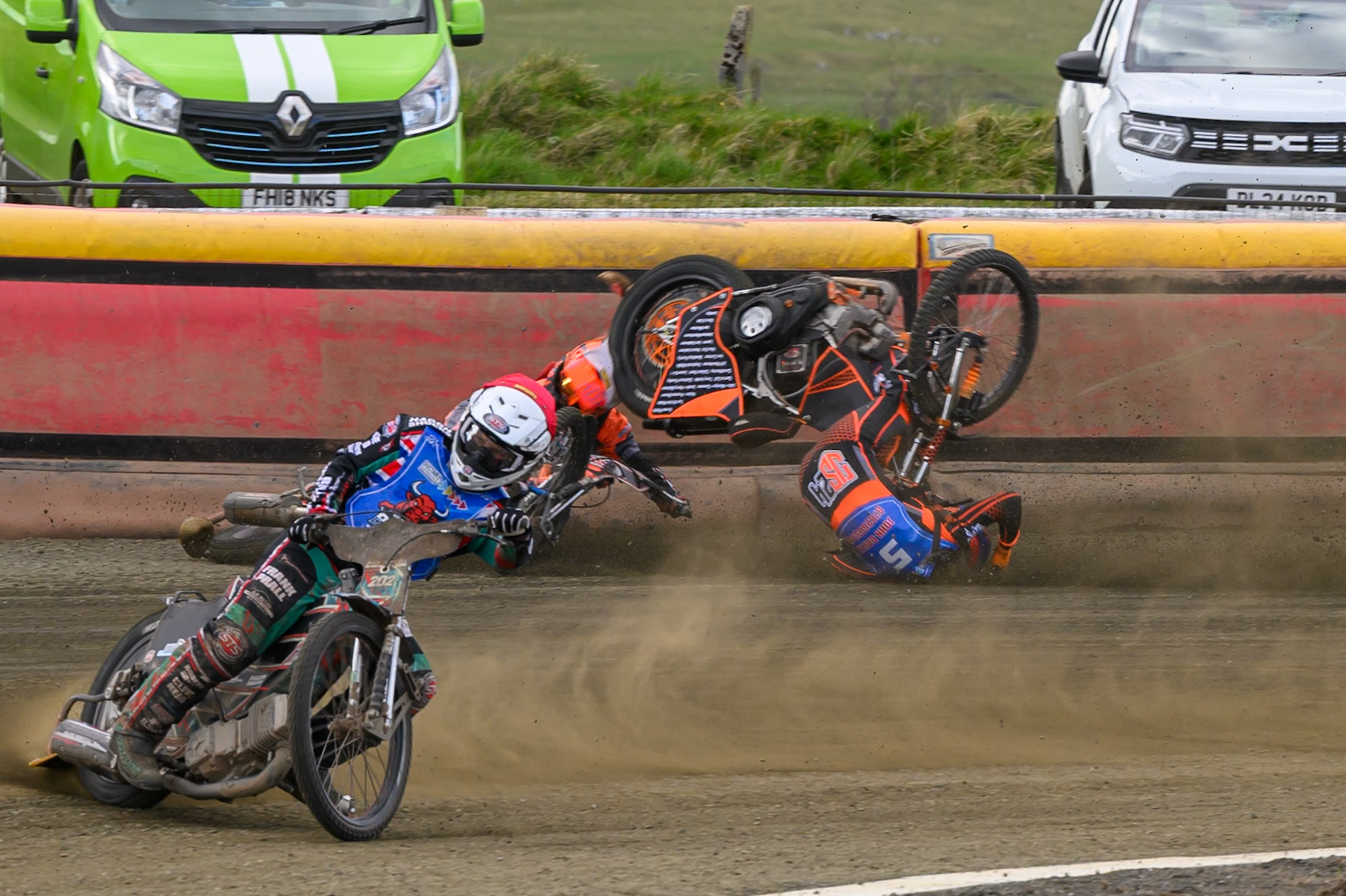 Connor Coles of NDL Nomads   in White fall and Jack Smith of Buxton Bulls   in Blue collides with him during the  Challenge match between Buxton Bulls and NDL Nomads at Hi-Edge Speedway, Buxton on Sunday 19th April 2026. (Photo: Ian Charles | MI News)