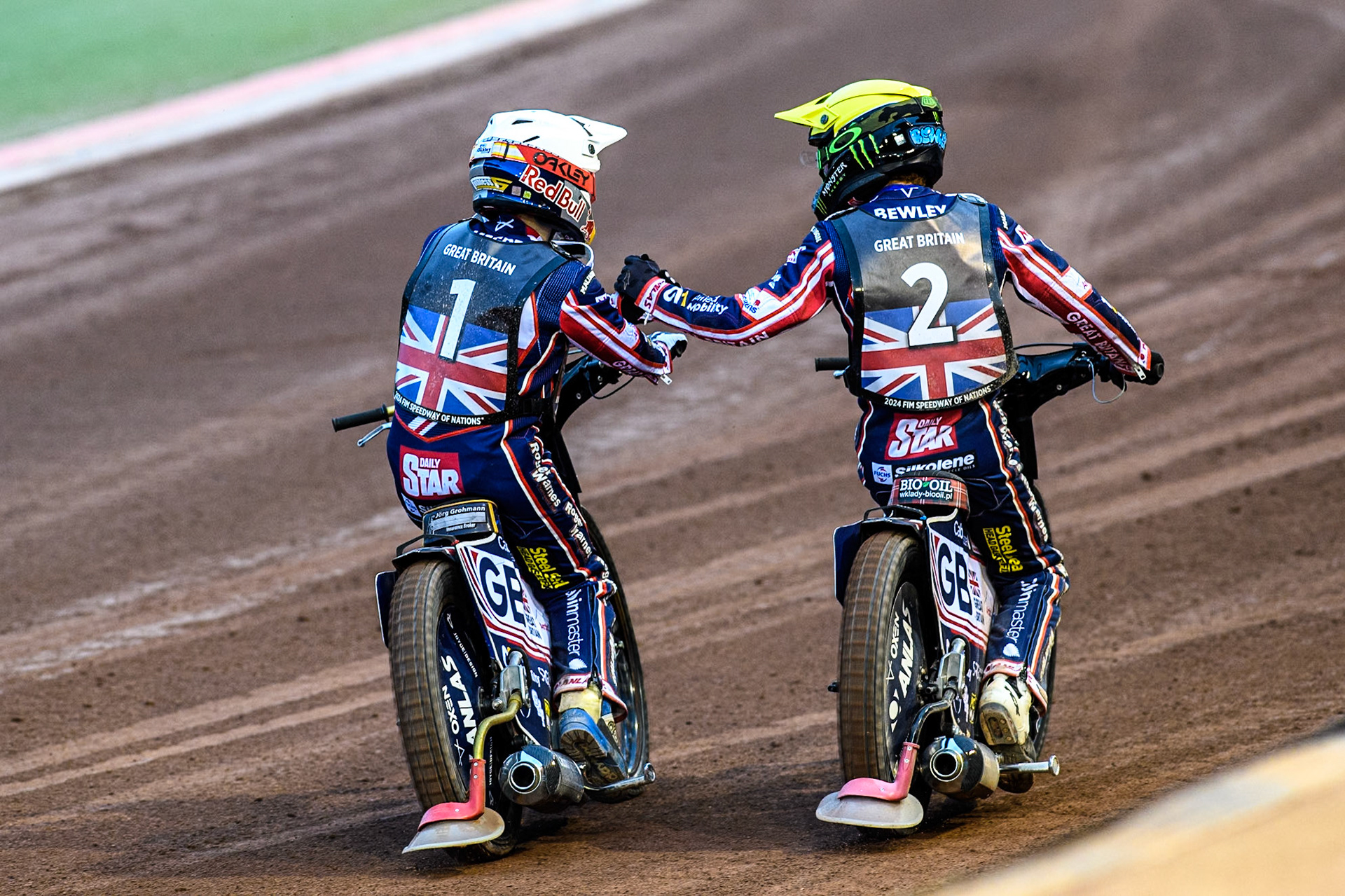 Robert Lambert in White and Dan Bewley of Great Britain celebrate another maximum heat win during the Monster Energy FIM Speedway of Nation Final at the National Speedway Stadium, Manchester on Saturday 13th July 2024. (Photo: Ian Charles | MI News)