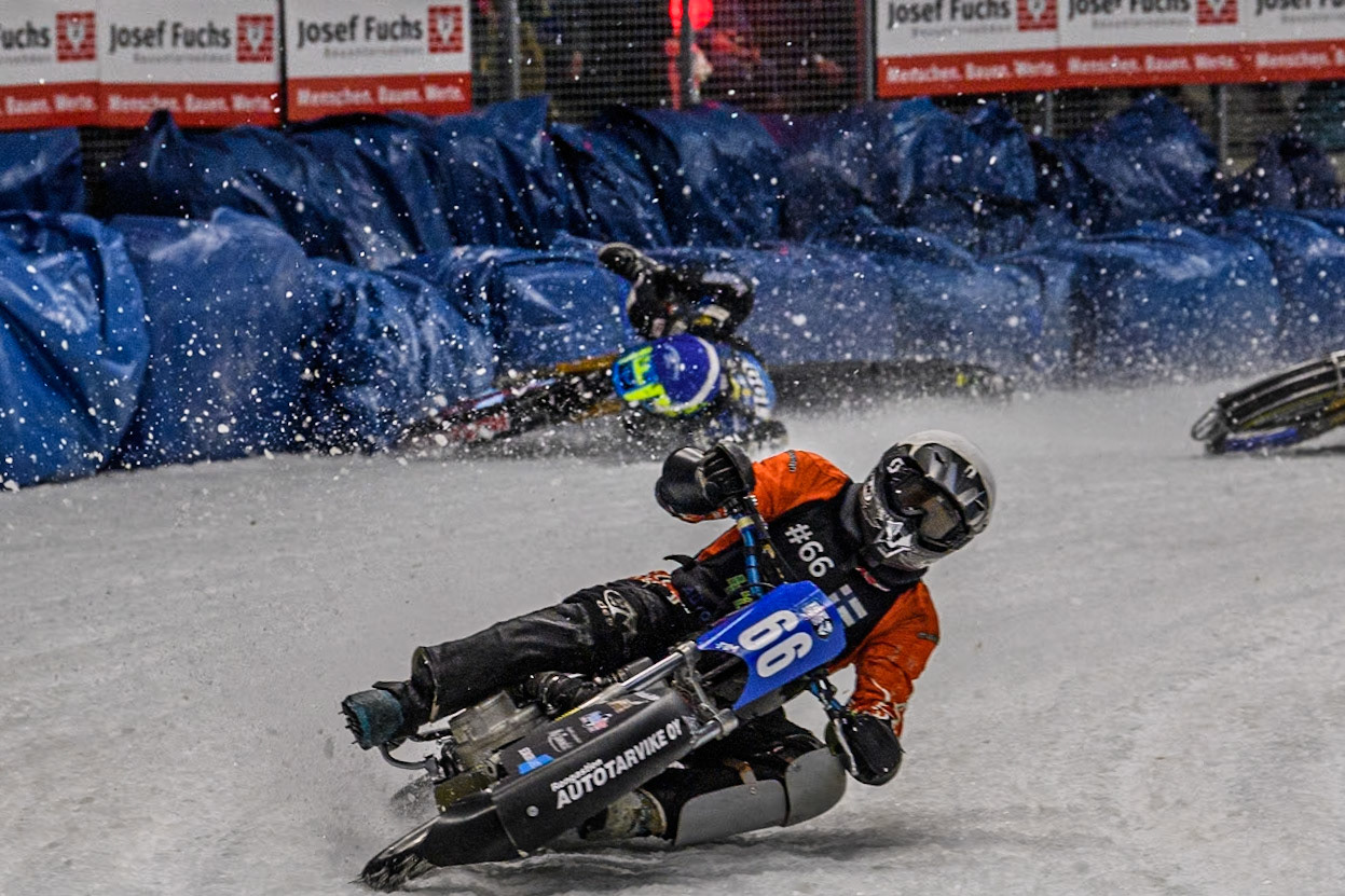 Finland's Aki Ala-Riihimäki (66) (White) leads  as Sweden's Martin Haarahiltunen (199)  (Blue) crashes out during the FIM Ice Speedway Gladiators World Championship Final 2 at the Max-Aicher-Arena, Inzell on Sunday 24 March 2024. (Photo: Ian Charles | MI News)