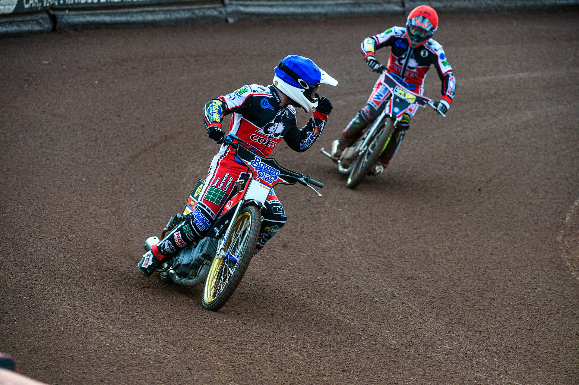 MANCHESTER, UK. JULY 23RD  Paul Bowen  (Blue) acknowledges his team mate Jack Parkinson-Blackburn  after heat 3during the National Development League match between Belle Vue Colts and Eastbourne Seagulls at the National Speedway Stadium, Manchester on Friday 23rd July 2021. (Credit: Ian Charles | MI News)