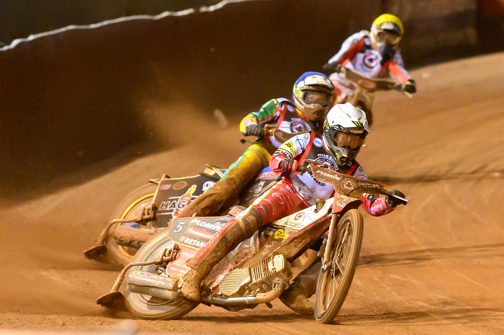 Dan Bewley  in White leading Jason Doyle  in Blue and Rasmus Jensen  in Yellow during the Peter Craven Memorial Trophy at the National Speedway Stadium, Manchester, on Monday 16th March 2026. (Photo: Ian Charles | MI News)