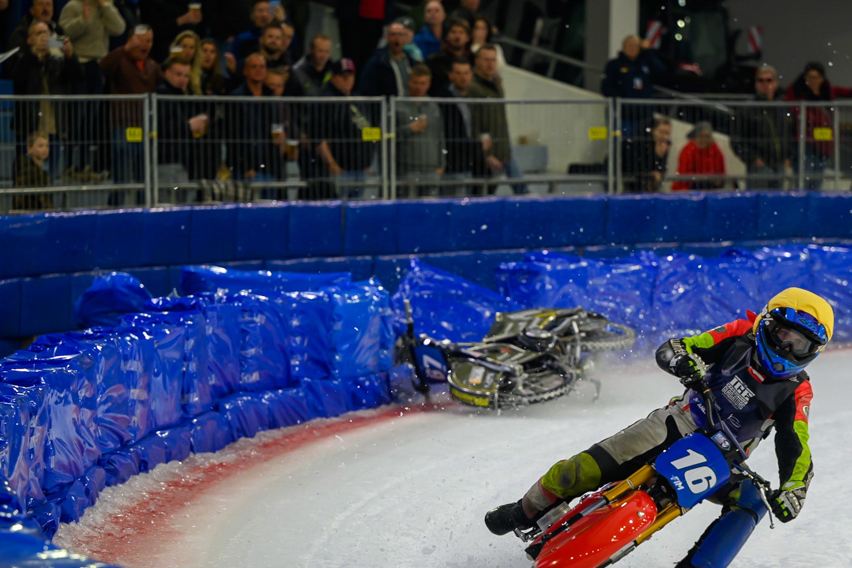 Heikki Huusko (67) of Finland  collides with Wild Card Harald Simon (16) of Austria in Yellow in the first turn during the FIM Ice Speedway Gladiators World Championship Final 3 at Ice Rink Thialf, Heerenveen on Saturday 11th April 2026. (Photo: Ian Charles | MI News)