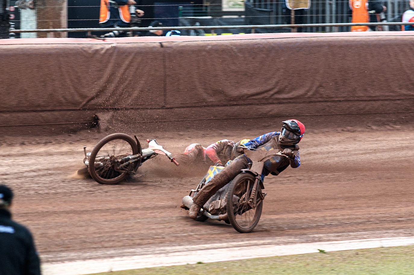 Bartosz Banbor of Poland falls behind Philip Hellström-Bängs of Sweden in Red during the Monster Energy FIM Speedway of Nations 2 (Under 21) Final at the National Speedway Stadium, Manchester on Friday 12th July 2024. (Photo: Ian Charles | MI News)