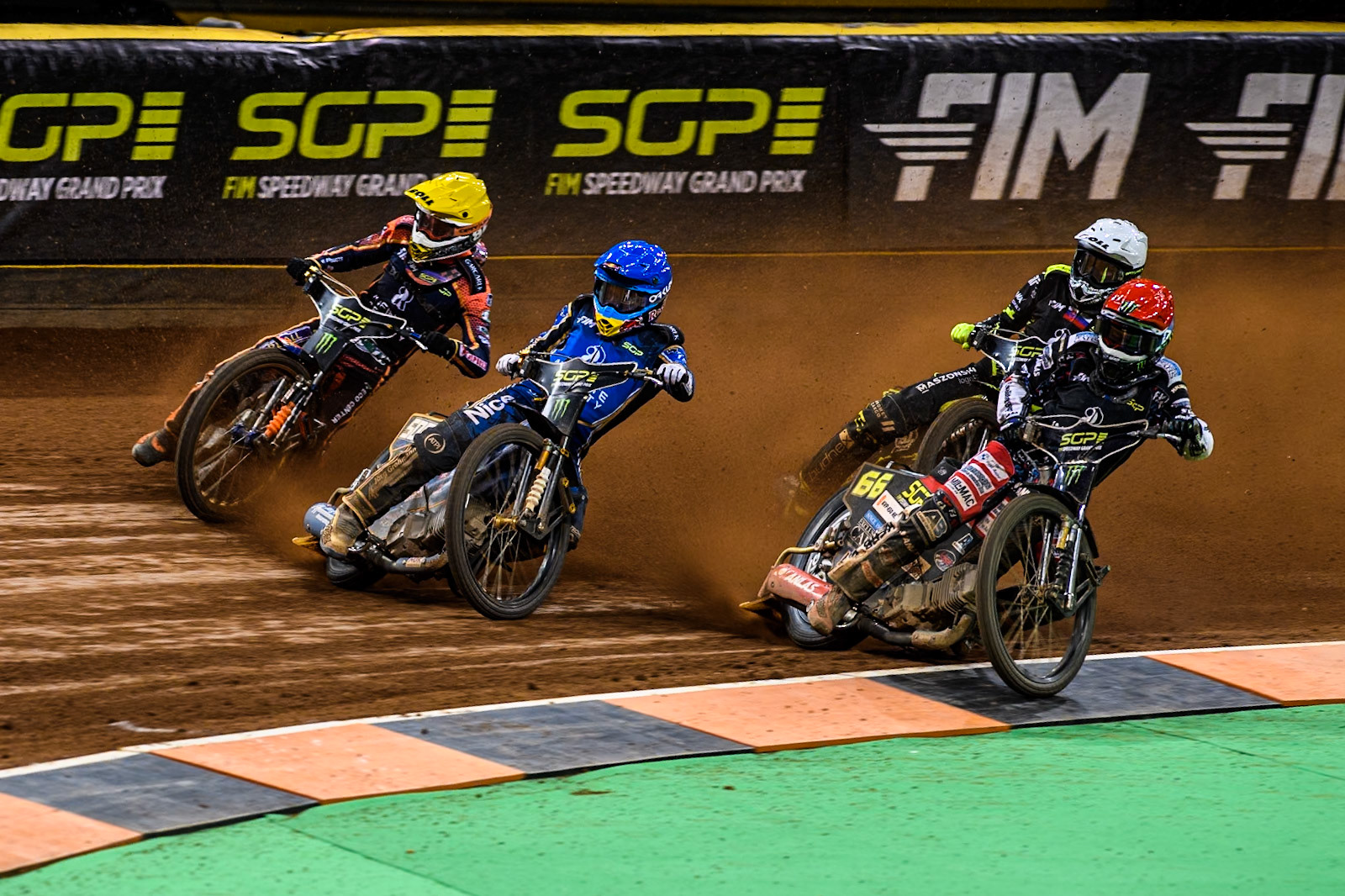 Semi Final 1: Fredrik Lindgren (66) of Sweden in Red rides inside Robert Lambert (505) of Great Britain in Blue and Mikkel Michelsen (155) of Denmark in Yellow with Martin Vaculik (54) of Slovakia in White behind during the FIM Speedway Grand Prix of Great Britain at The Principality Stadium, Cardiff on Saturday 17th August 2024. (Photo: Ian Charles | MI News)