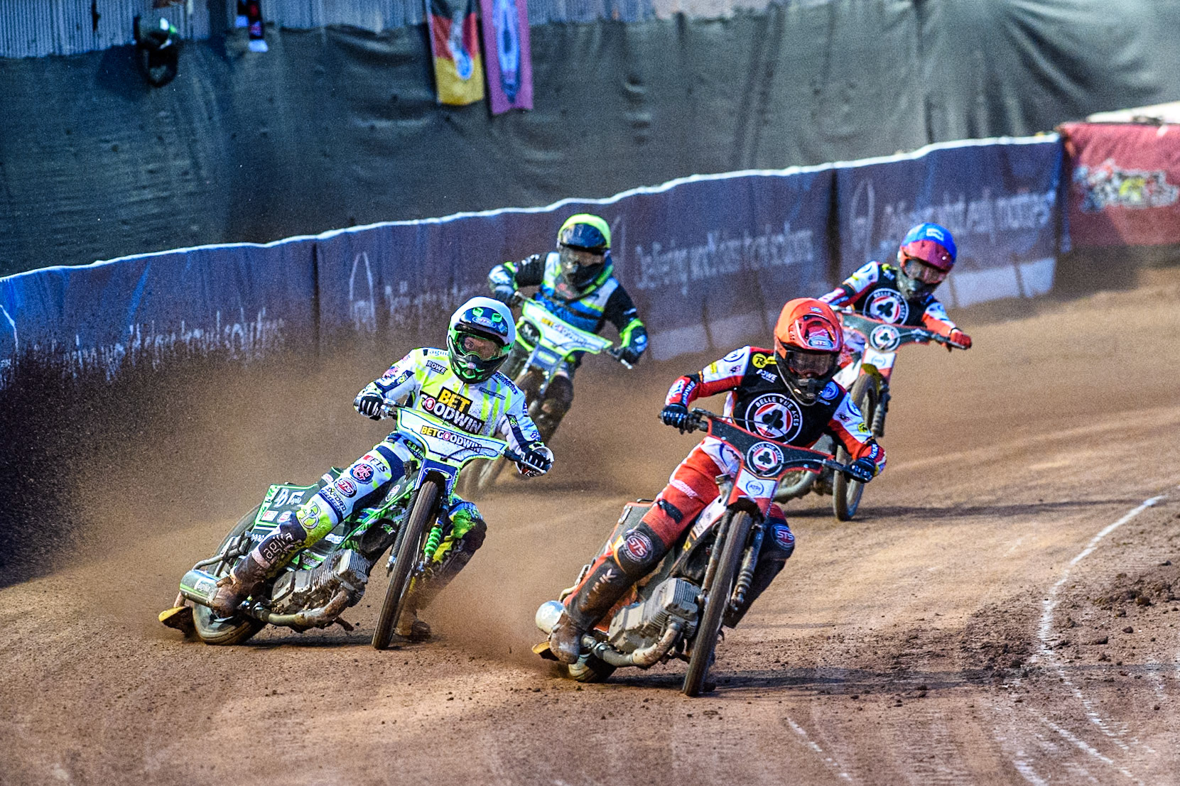 Belle Vue Aces' Zack Cook in Red rides inside Oxford Spires' Charles Wright in White, with Belle Vue Aces' Tate Zischke in Blue and Oxford Spires' Guest Rider Dan Thompson in Yellow behind during the Rowe Motor Oil Premiership match between Belle Vue Aces and Oxford Spires at the National Speedway Stadium, Manchester on Monday 14th April 2025. (Photo: Ian Charles | MI News)
