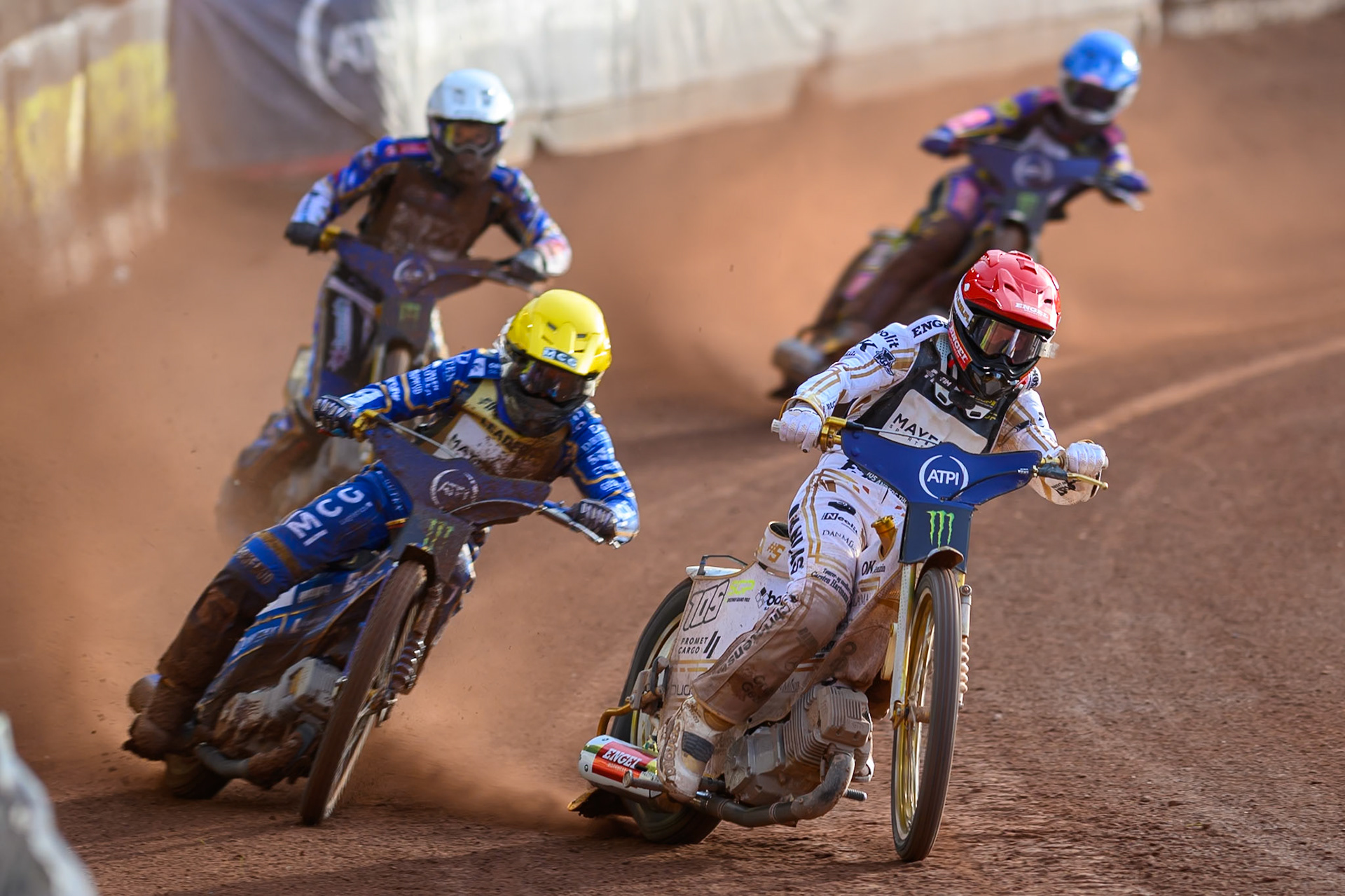 Anders Thomsen (105) of Denmark in Red rides outside Bartosz Zmarzlik (95) of Poland in Yellow with Jason Doyle (69) of Australia in White and Kacper Woryna (223) of Poland in Blue behind during the ATPI  FIM Speedway GP of Manchester at the National Speedway Stadium, Manchester on Friday 5th June 2026. (Photo: Ian Charles | MI News)