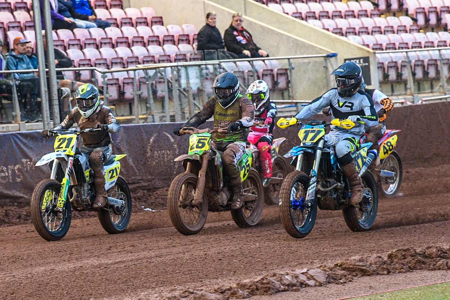 (l - r) Jarred Brook (21) from Australia Klaus Mayr (25) from Austria and Gerard Bailo (17) from Spain lead away from the start during the FIM World Flat Track Championship Round 1 at the National Speedway Stadium, Manchester on Saturday 5th August 2023. (Photo: Ian Charles | MI News)