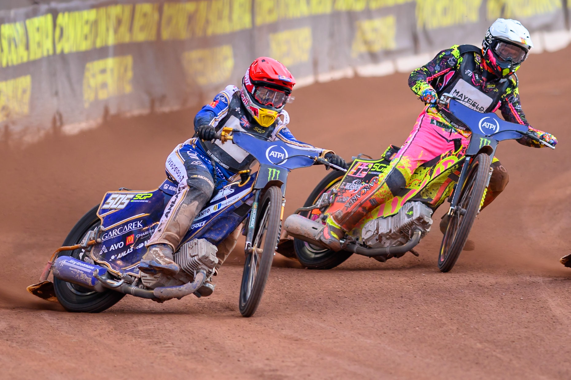 Robert Lambert (505) of Great Britain in Red rides outside Michael Jepsen Jensen (52) of Denmark in White during the ATPI  FIM Speedway GP of Manchester at the National Speedway Stadium, Manchester on Friday 5th June 2026. (Photo: Ian Charles | MI News)