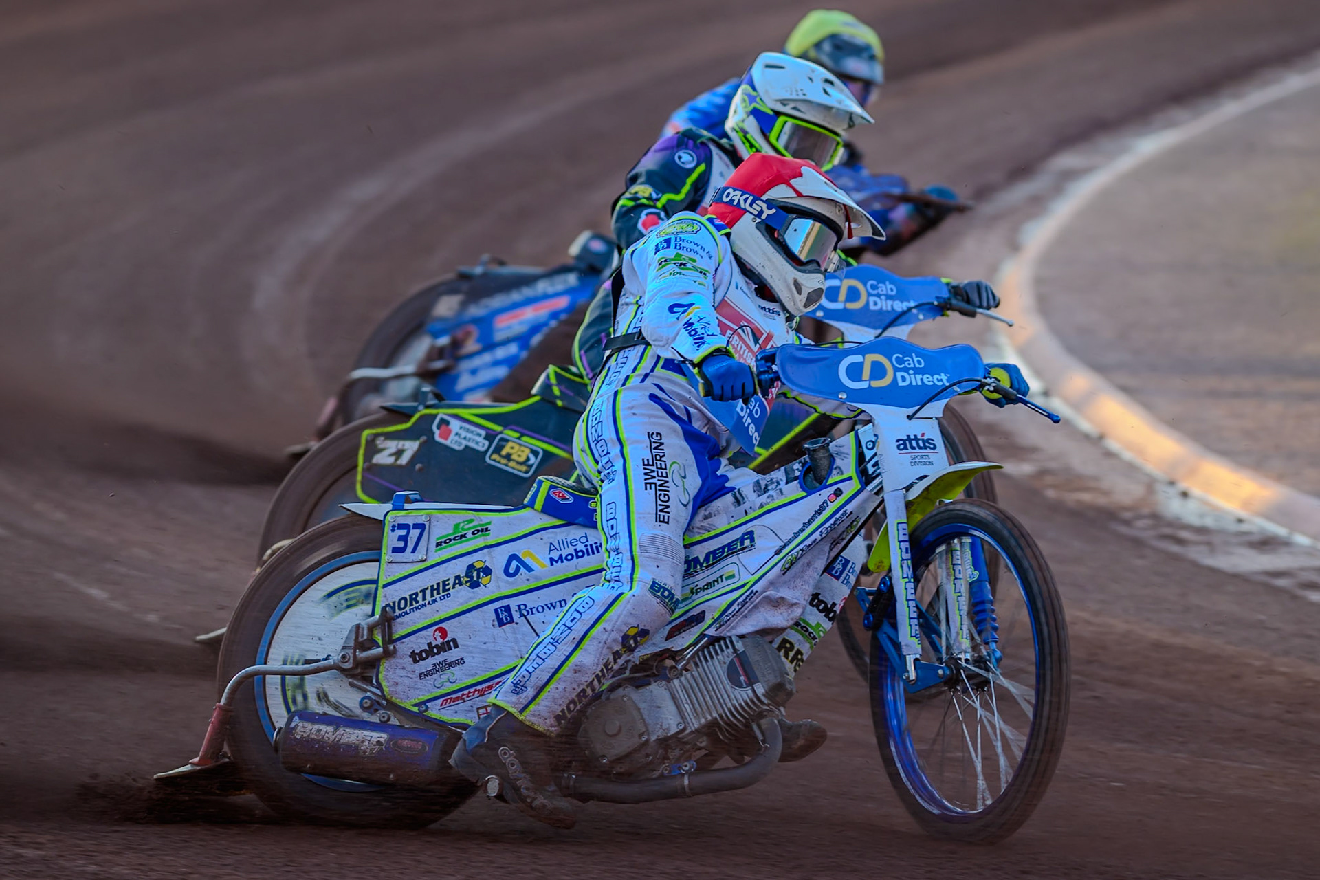 Chris Harris (15) in Red rides outside Tom Brennan (16) in White and Jody Scott (13) in Yellow during the Cab Direct British Speedway Championship Final at the National Speedway Stadium, Manchester on Saturday 15th August 2026. (Photo: Ian Charles | MI News)