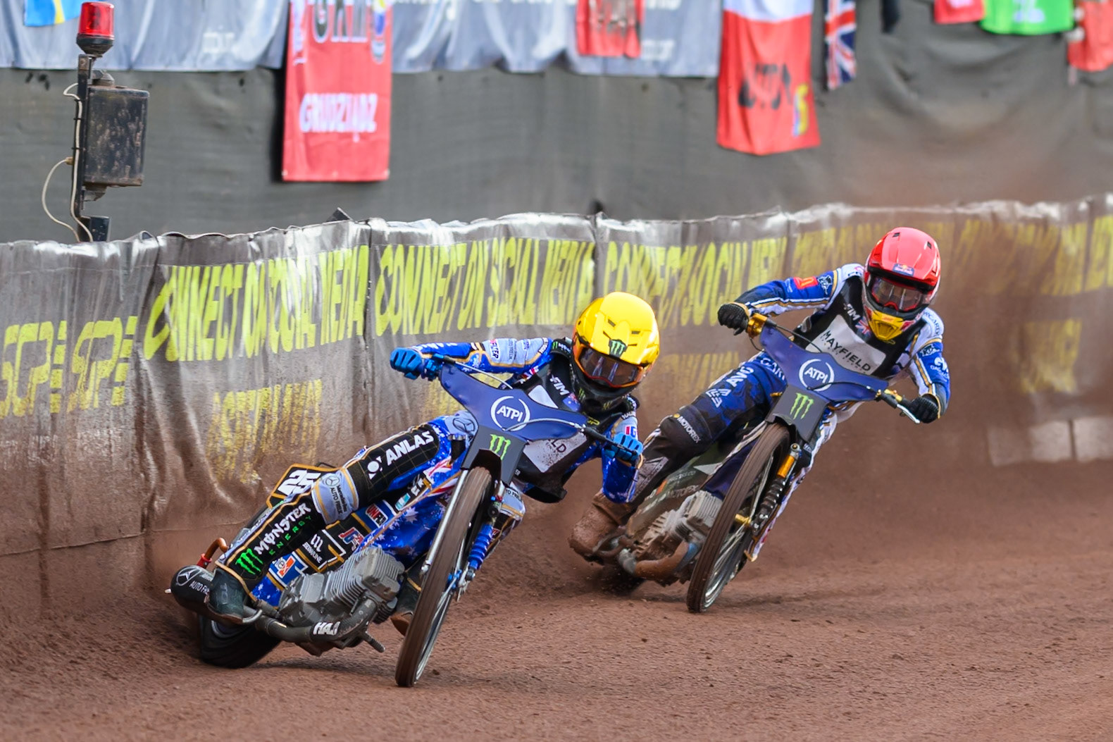 Jack Holder (25) of Australia in Yellow leading Robert Lambert (505) of Great Britain in Red during the ATPI  FIM Speedway GP of Manchester at the National Speedway Stadium, Manchester on Saturday 6th June 2026. (Photo: Ian Charles | MI News)