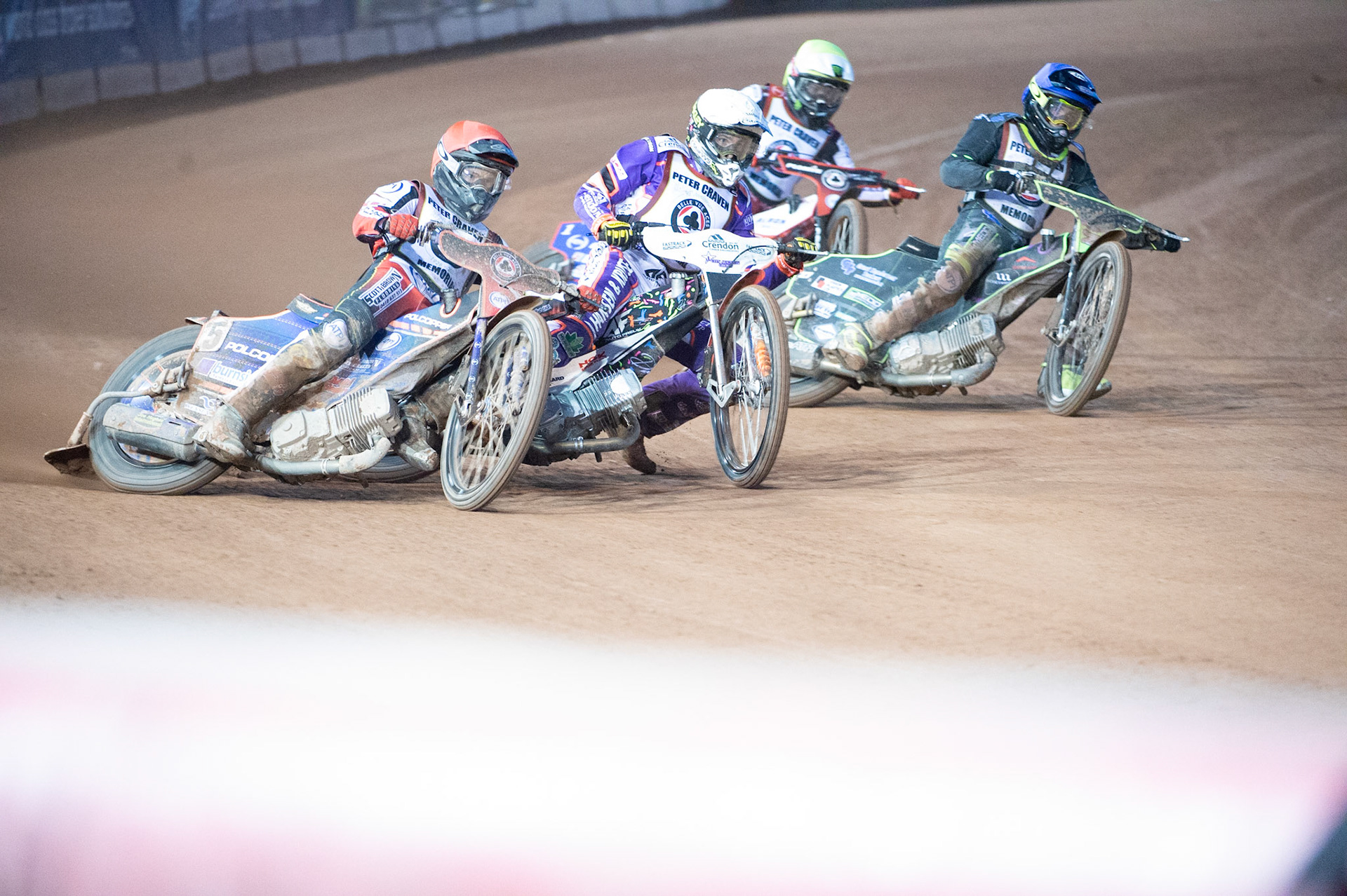 Brady Kurtz  (Red) outside Niels-Kristian Iversen  (White) and Tom Brennan  (Blue) with Dan Bewley  (Yellow) behind during the Peter Craven Memorial Trophy  at the National Speedway Stadium, Manchester on Monday 3rd April 2023. (Photo: Ian Charles | MI News)