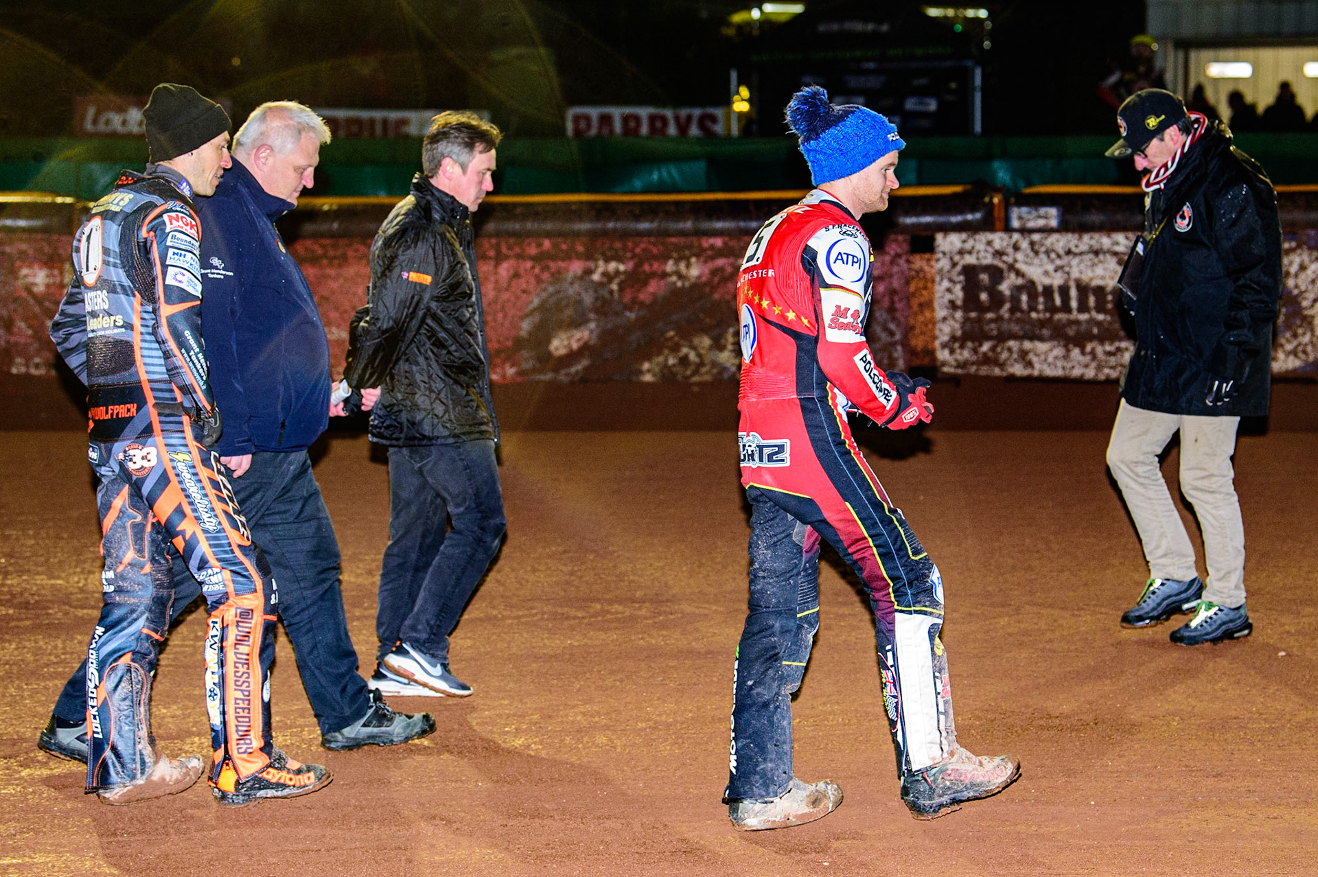 As the rain falls the Referee Dave Watter (2nd left) inspects the track with Sam Masters  (far left),Chris Adams (3rd left), Brady Kurtz  (2nd right) and Mark Lemon  (far right) during the SGB Premiership Knock Out Cup Quarter Final 1st Leg between Wolverhampton Wolves and Belle Vue Aces at Monmore Green Stadium, Wolverhampton on Monday 10th April 2023. (Photo: Ian Charles | MI News)