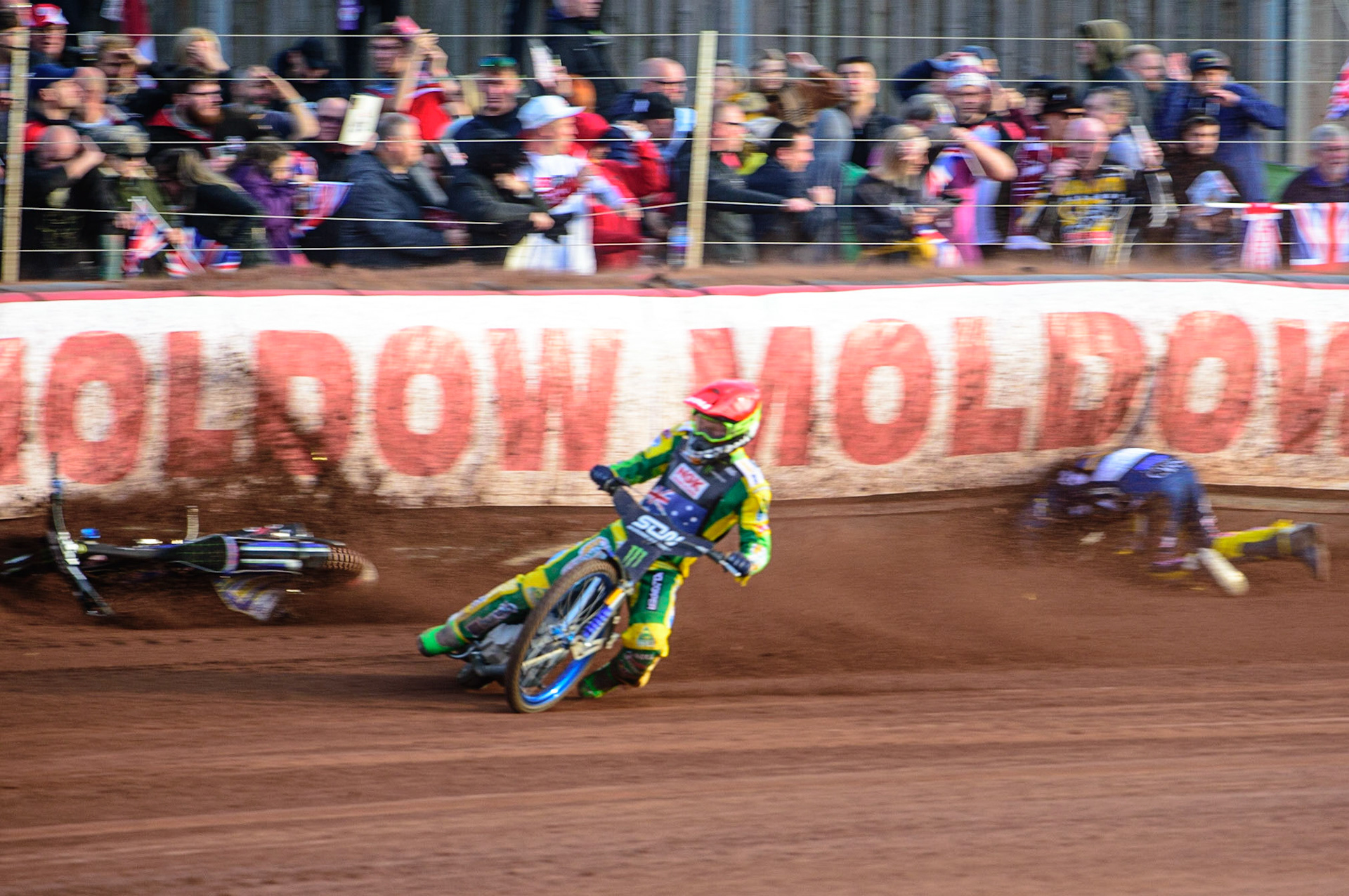 MANCHESTER, UK. OCT 16TH Pontus Aspgren of Sweden (White) slides off as Jacob Thorsell of Sweden hits the airfence during the Monster Energy FIM Speedway of Nations at the National Speedway Stadium, Manchester on Saturday  16th October 2021. (Credit: Ian Charles | MI News)