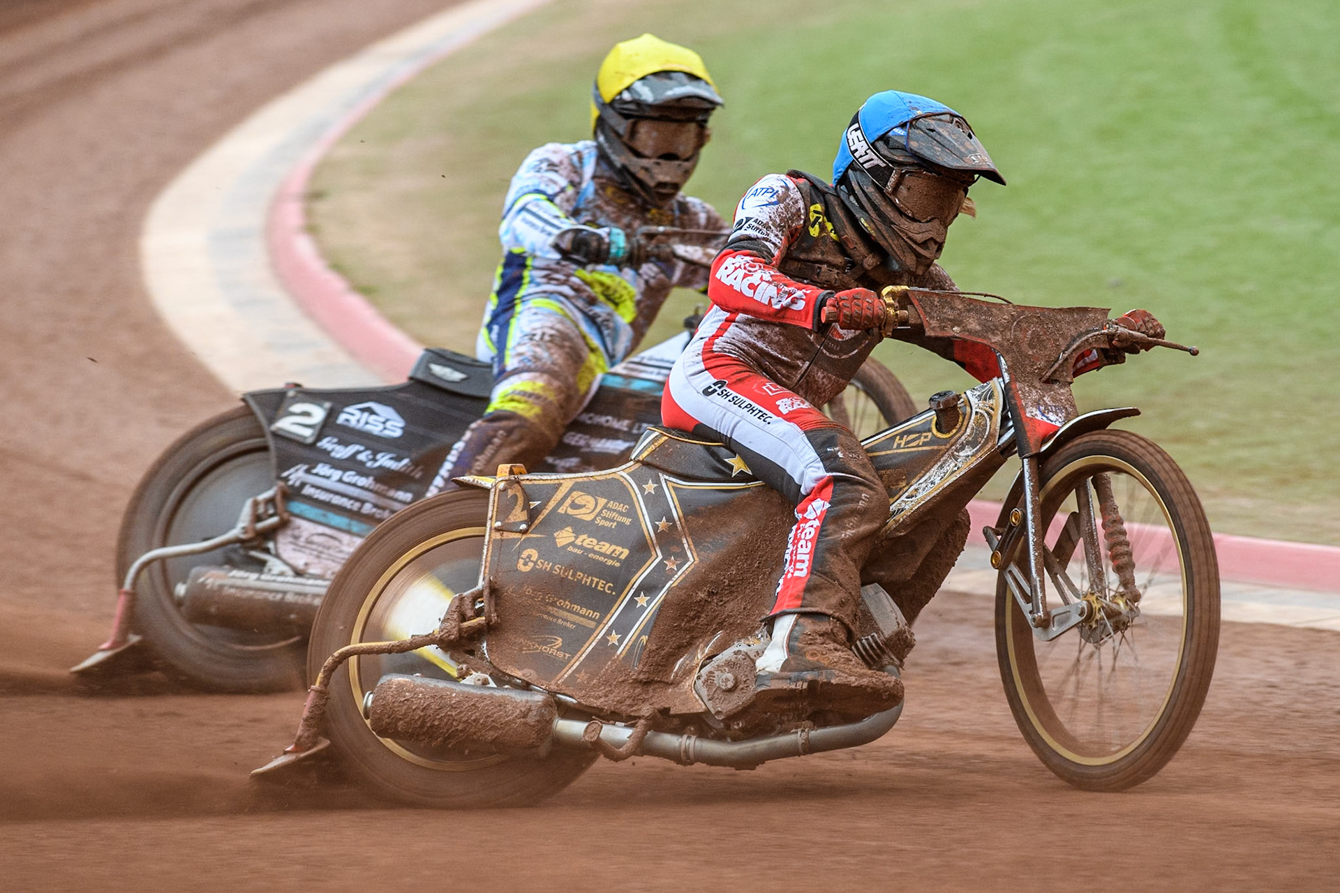 Belle Vue Aces' Norick Blodorn  in Blue rides outside Oxford Spires' Erik Riss  in Yellow during the Rowe Motor Oil Premiership match between Belle Vue Aces and Oxford Spires at the National Speedway Stadium, Manchester on Monday 22nd July 2024. (Photo: Ian Charles | MI News)