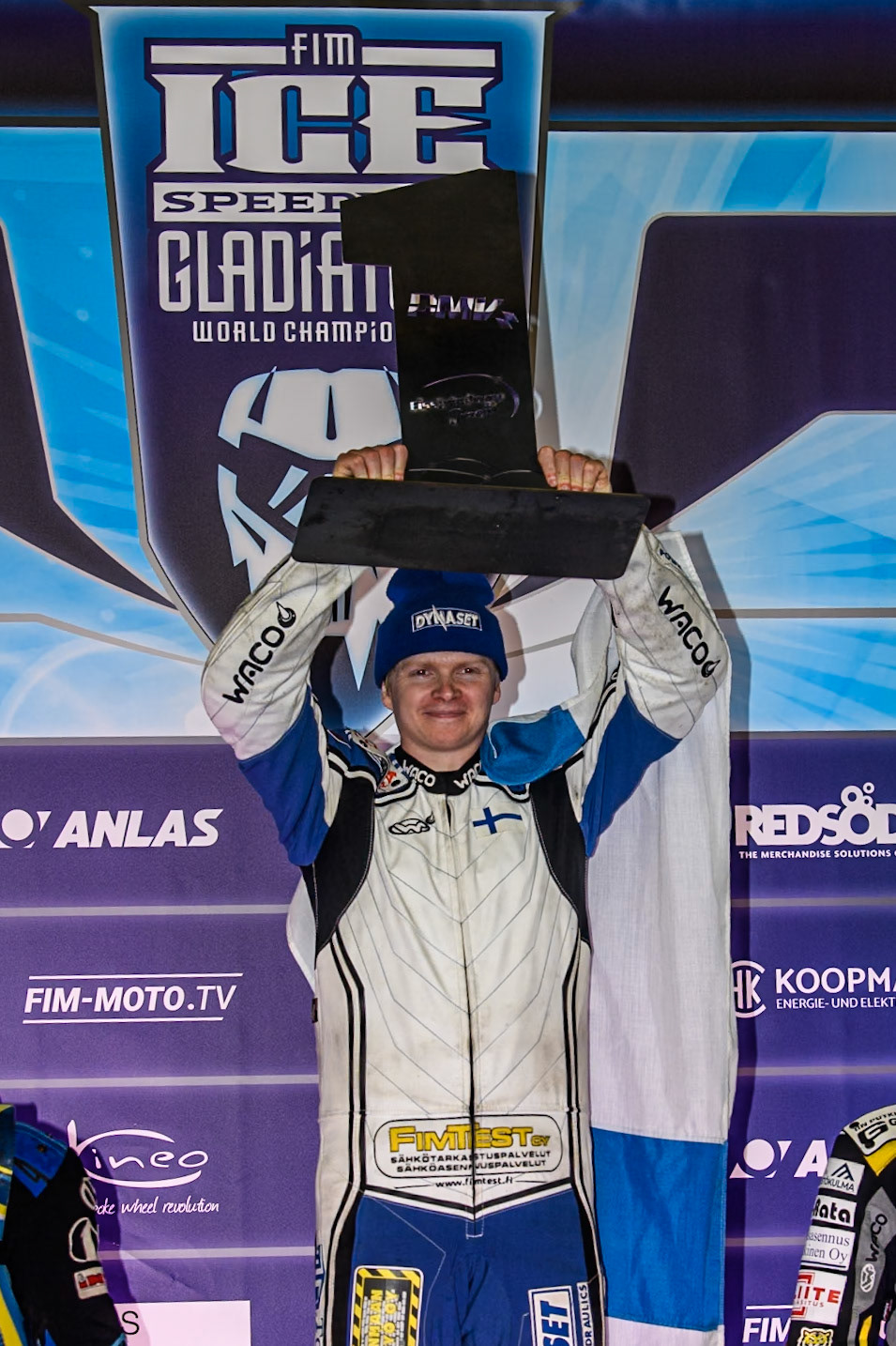 Max Koivula (24) of Finland holds up the winners trophy during the Ice Speedway Gladiators World Championship Final 1 at Max-Aicher-Arena, Inzell on Saturday 15th March 2025. (Photo: Ian Charles | MI News)