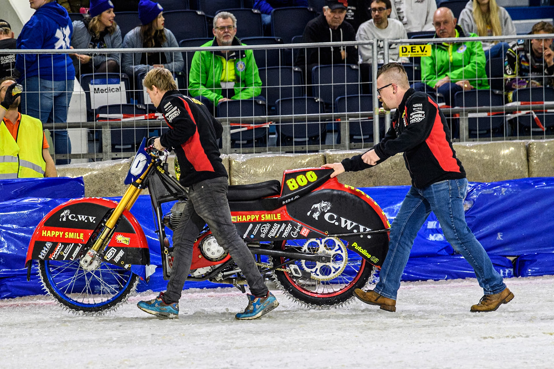 Netherlands' Jasper Iwema’s team push his bike back to the pits after an engine failure during the FIM Ice Speedway Gladiators World Championship Final 3 at Ice Rink Thialf, Heerenveen on Saturday 6th April 2024. (Photo: Ian Charles | MI News)