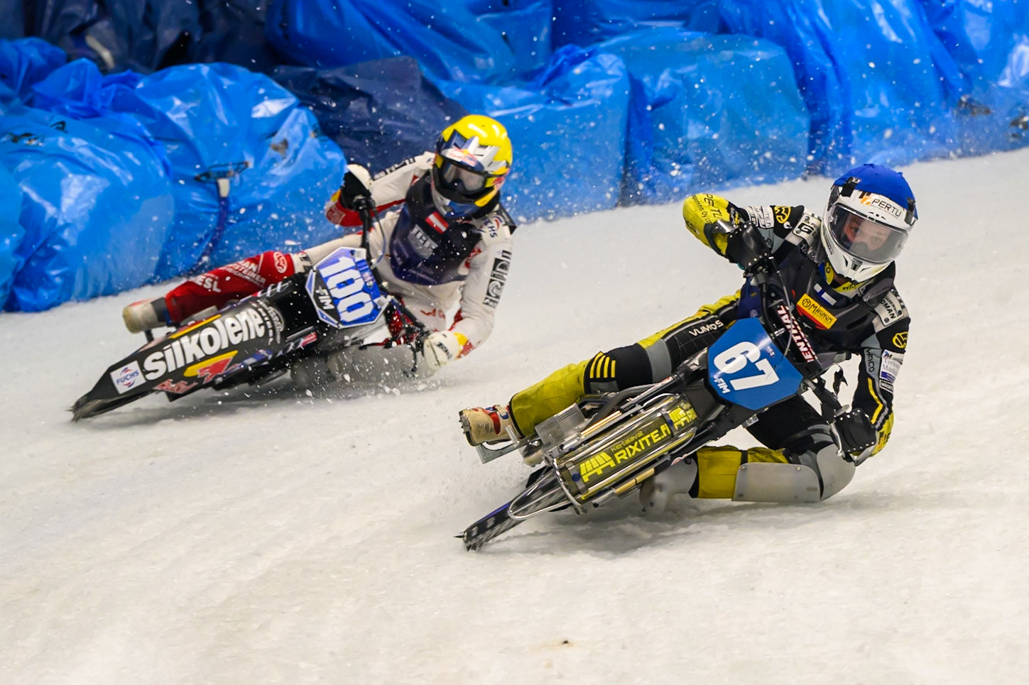 Heikki Huusko (67) of Finland in Blue leading Franz Zorn (100) of Austria in Yellowduring the Ice Speedway Gladiators World Championship Final 2 at Max-Aicher-Arena, Inzell on Sunday 15th March 2026. (Photo: Ian Charles | MI News)