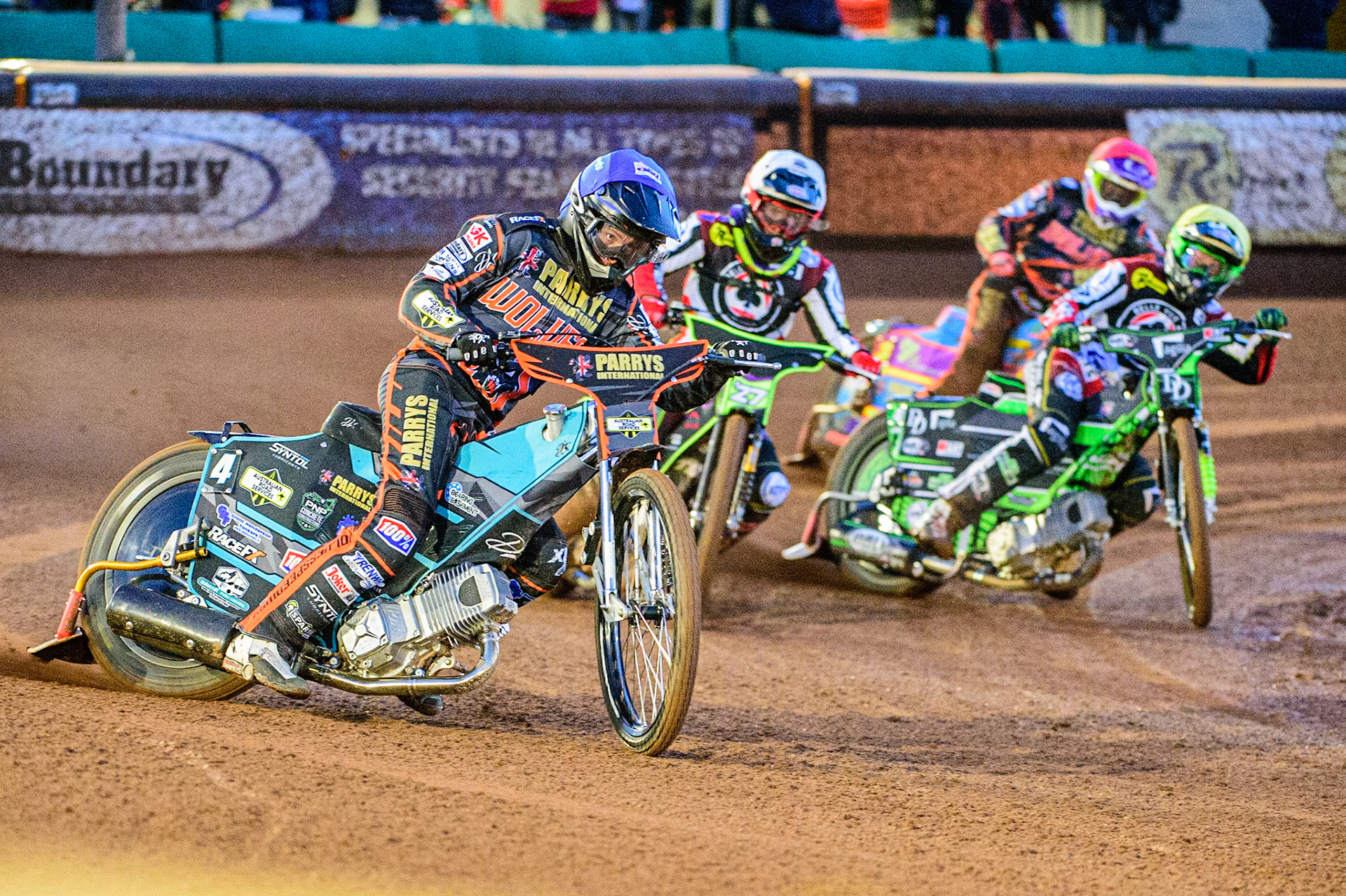 Ryan Douglas  (Blue) leads Tom Brennan  (White) and Charles Wright  (Yellow) with Rory Schlein  (Red) behind during the SGB Premiership Knock Out Cup Quarter Final 1st Leg between Wolverhampton Wolves and Belle Vue Aces at Monmore Green Stadium, Wolverhampton on Monday 10th April 2023. (Photo: Ian Charles | MI News)