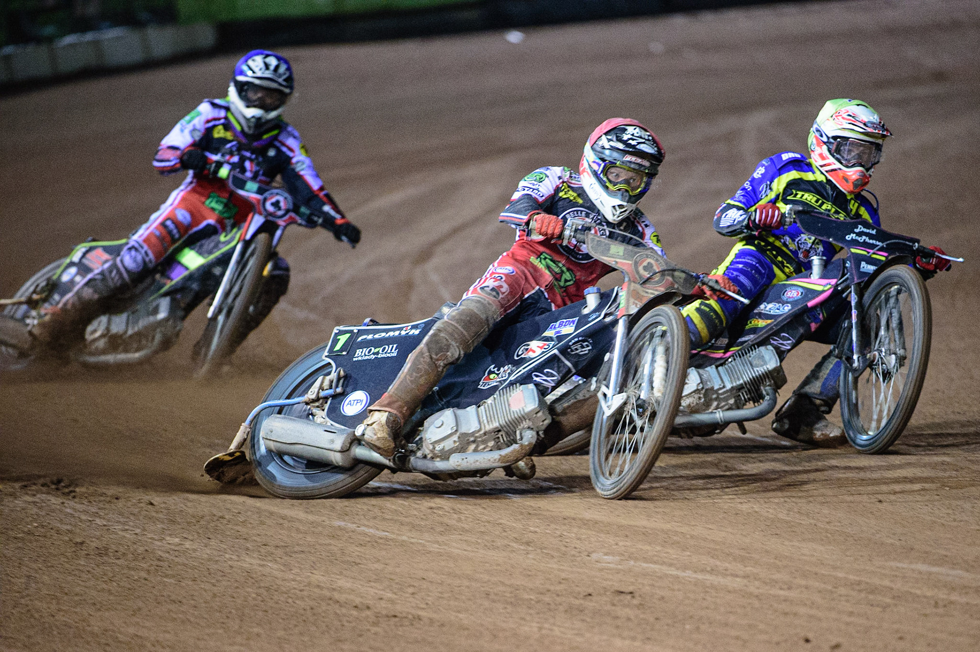 MANCHESTER, UK. OCT 7TH  Dan Bewley  (Red) leads Josh Pickering    (Yellow) with Tom Brennan  (Blue) behind during the SGB Premiership Play off Semi-Final Second Leg between Belle Vue Aces and Sheffield Tigers at the National Speedway Stadium, Manchester on Thursday 7th October 2021. (Credit: Ian Charles | MI News)