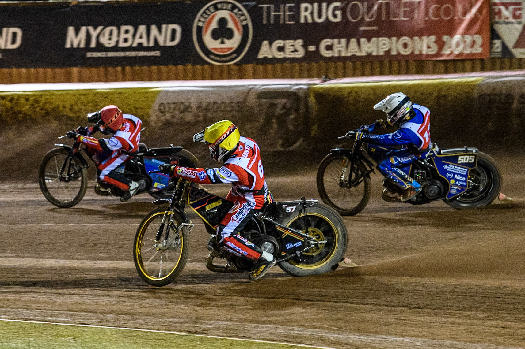 Australia's Ben Cook (Red) leads  England's Connor Mountain (Yellow) and England's Robert Lambert (White) during the Peter Craven Memorial Trophy meeting at the National Speedway Stadium, Manchester on Monday 18th March 2024. (Photo: Ian Charles | MI News)