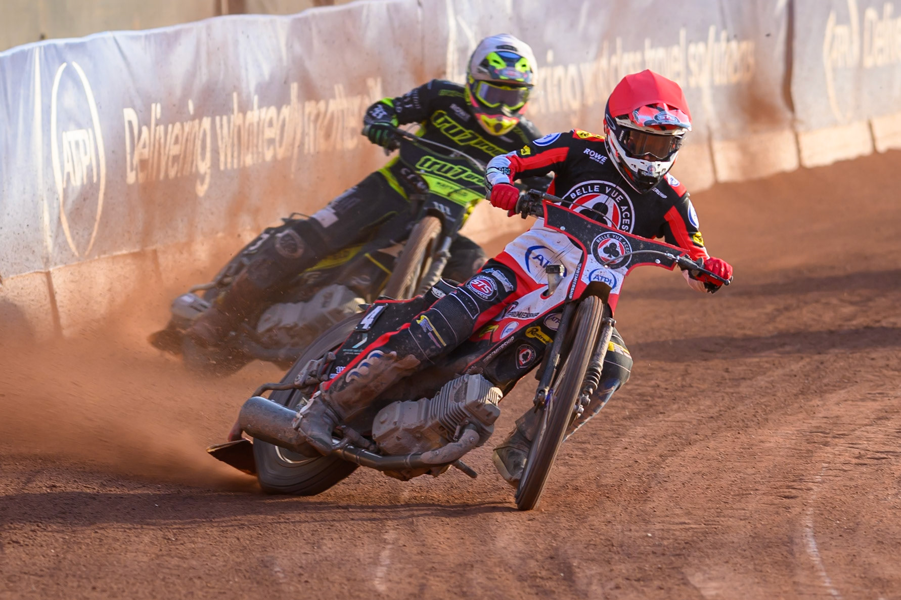 Zach Cook of Belle Vue Aces in Red leading Richard Lawson of Ipswich Witches in White during the Rowe Motor Oil Premiership match between Belle Vue Aces and Ipswich Witches at the National Speedway Stadium, Manchester on Saturday 20th June 2026. (Photo: Ian Charles | MI News)
