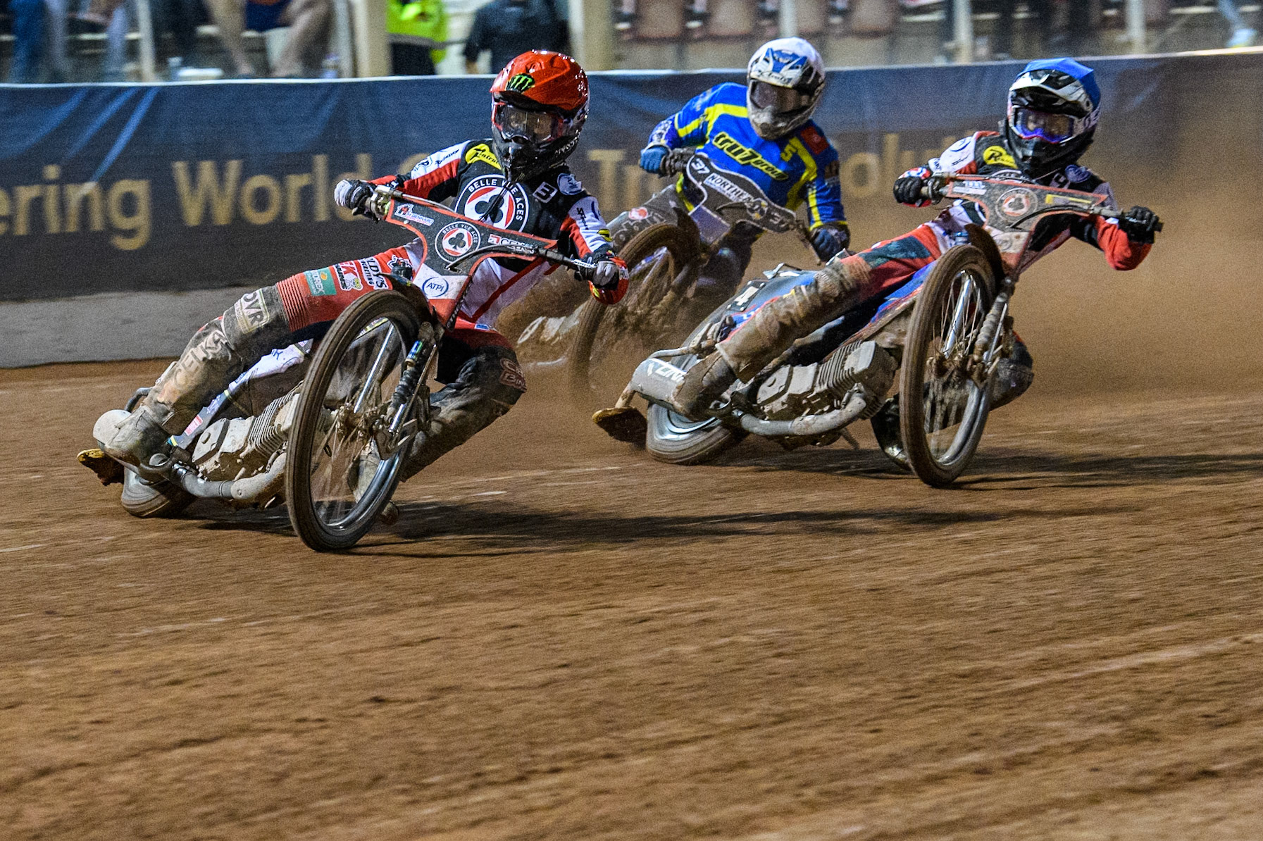 Belle Vue Aces' Jaimon Lidsey  in Red leading Belle Vue Aces' Ben Cook  in Blue and Sheffield Tigers' Guest Rider Chris Harris  in White during the Rowe Motor Oil Premiership Play Off Semi Final 2, 1st Leg match between Belle Vue Aces and Sheffield Tigers at the National Speedway Stadium, Manchester on Monday 16th September 2024. (Photo: Ian Charles | MI News)