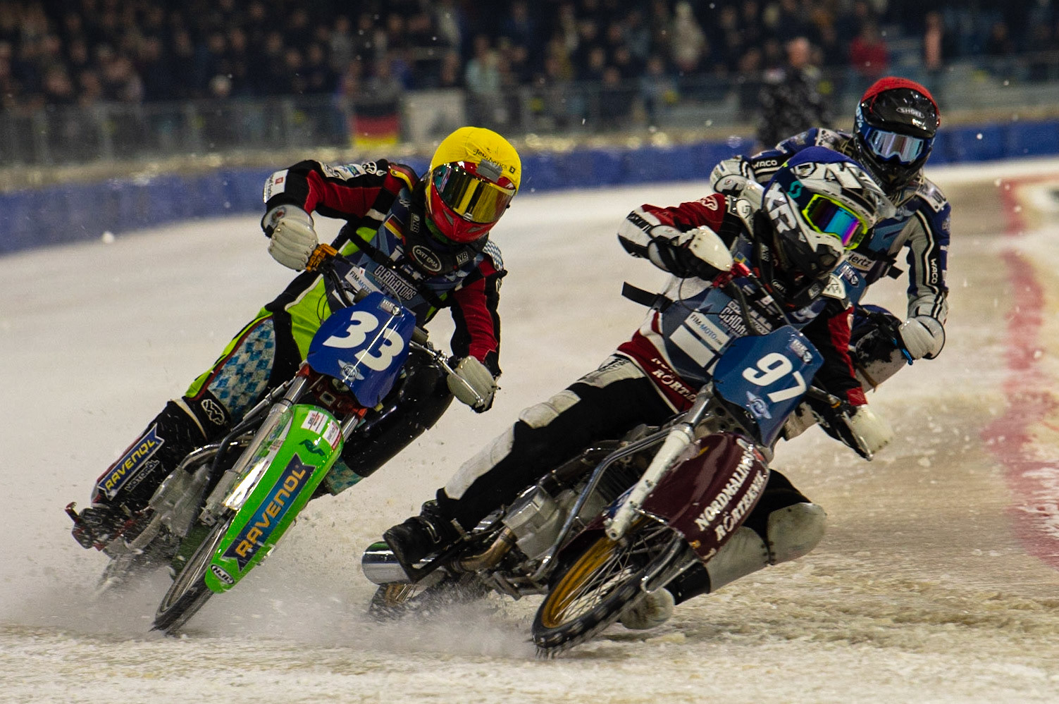 HEERENVEEN, NL. Ove Ledström (97)  (Blue) inside Johann Weber (33)  (Yellow) with Max Koivula (24) behind during the FIM Ice Speedway Gladiators World Championship Final 3 at Ice Rink Thialf, Heerenveen on Saturday  2 April 2022. (Credit: Ian Charles | MI News)