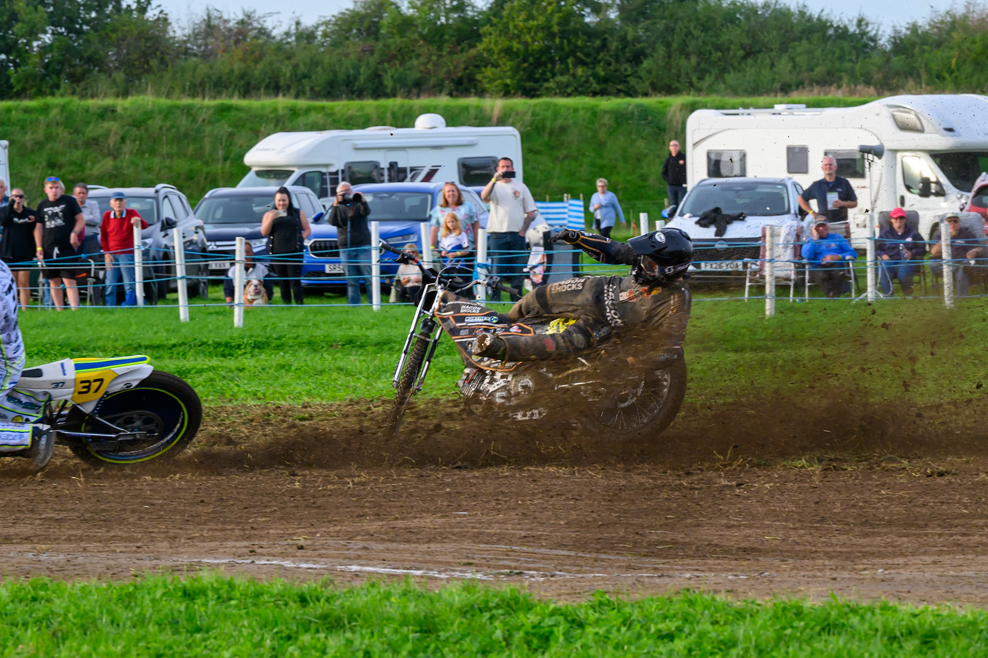 British Masters (Solos): Ashton Vale (152) catches the back wheel of Chris Harris (37)  and comes off during the British Masters Grasstrack Championship at Lower Marsh Farm, Much Hoole, Preston in Lancashire, England on Sunday 13th September 2026. (Photo: Ian Charles | MI News)