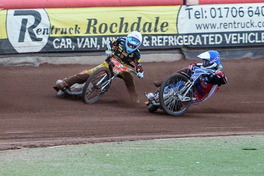 MANCHESTER, UK. JULY 29TH   Harry McGurk (Blue) picks up some drive and falls during the National Development League match between Belle Vue Colts and Leicester Lion Cubs at the National Speedway Stadium, Manchester on Thursday 29th July 2021. (Credit: Ian Charles | MI News)