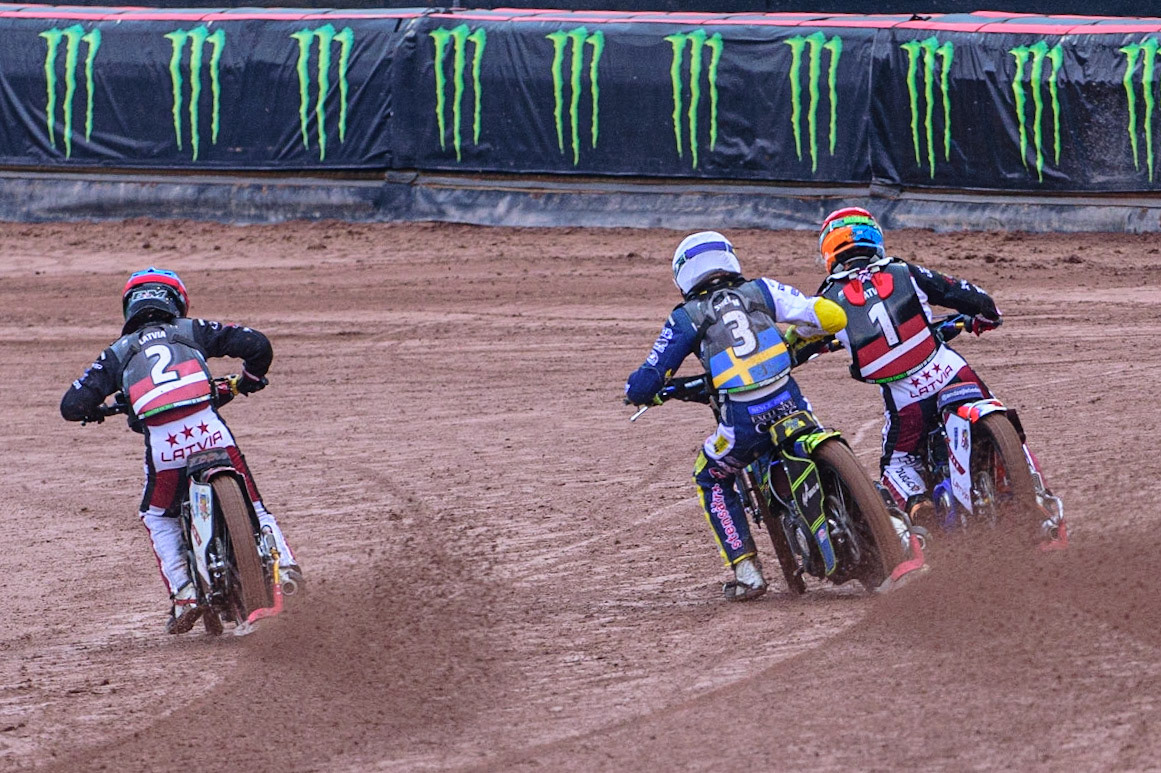 MANCHESTER, UK. OCT 17TH First race on Day 2 as Olegs Mijailovs of Latvia (Blue) Philip Hellström-Bangs of Sweden (White) and Andzejs Lebedevs of Latvia (Red) hit the first turnduring the Monster Energy FIM Speedway of Nations at the National Speedway Stadium, Manchester on Sunday  17th October 2021. (Credit: Ian Charles | MI News)