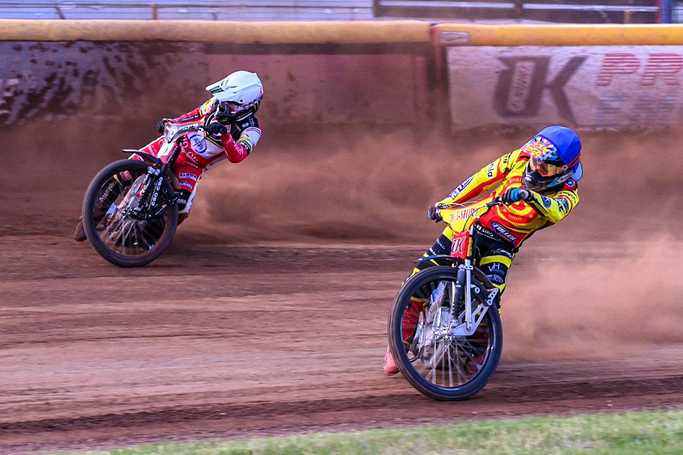 Birmingham Brummies' Jonas Jeppesen in Blue rides inside Belle Vue Aces' Dan Bewley in White during the Rowe Motor Oil Premiership match between Birmingham Brummies and Belle Vue Aces at Perry Bar Stadium, Birmingham on Monday 2nd June 2025. (Photo: Ian Charles | MI News)