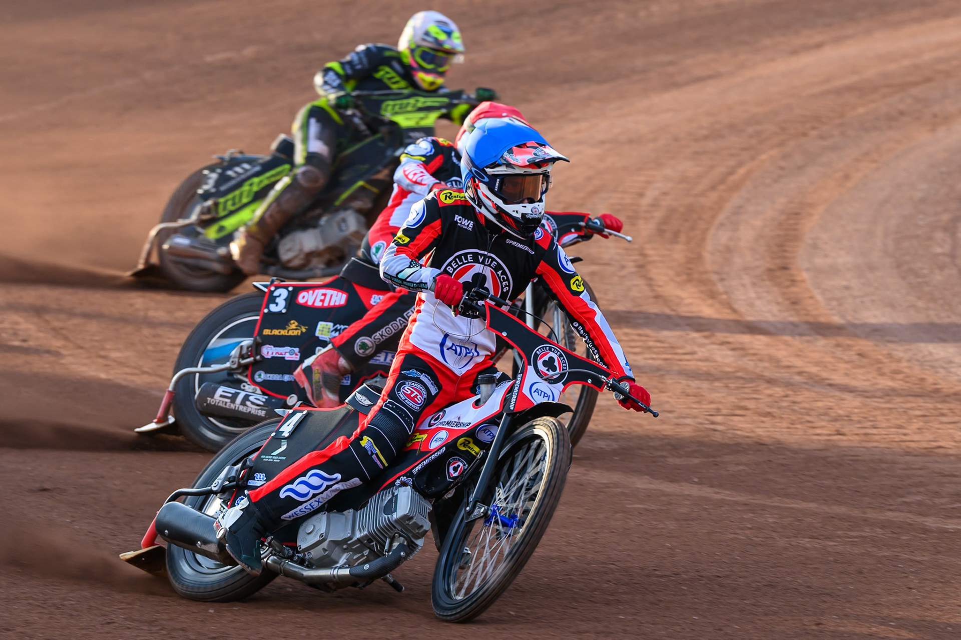 Zach Cook of Belle Vue Aces in Blue leading Peter Kildemand of Belle Vue Aces in Red and Richard Lawson of Ipswich Witches in White during the Rowe Motor Oil Premiership match between Belle Vue Aces and Ipswich Witches at the National Speedway Stadium, Manchester on Saturday 20th June 2026. (Photo: Ian Charles | MI News)