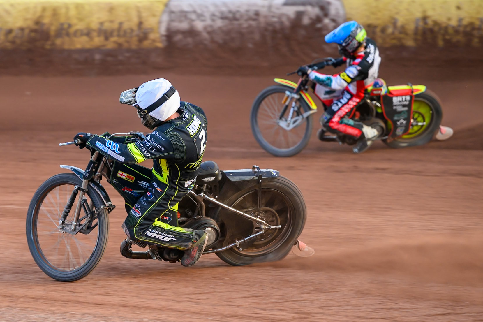 Danny King of Ipswich Witches in White rides inside Tate Zischke of Belle Vue Aces in Blue during the Rowe Motor Oil Premiership match between Belle Vue Aces and Ipswich Witches at the National Speedway Stadium, Manchester on Saturday 20th June 2026. (Photo: Ian Charles | MI News)