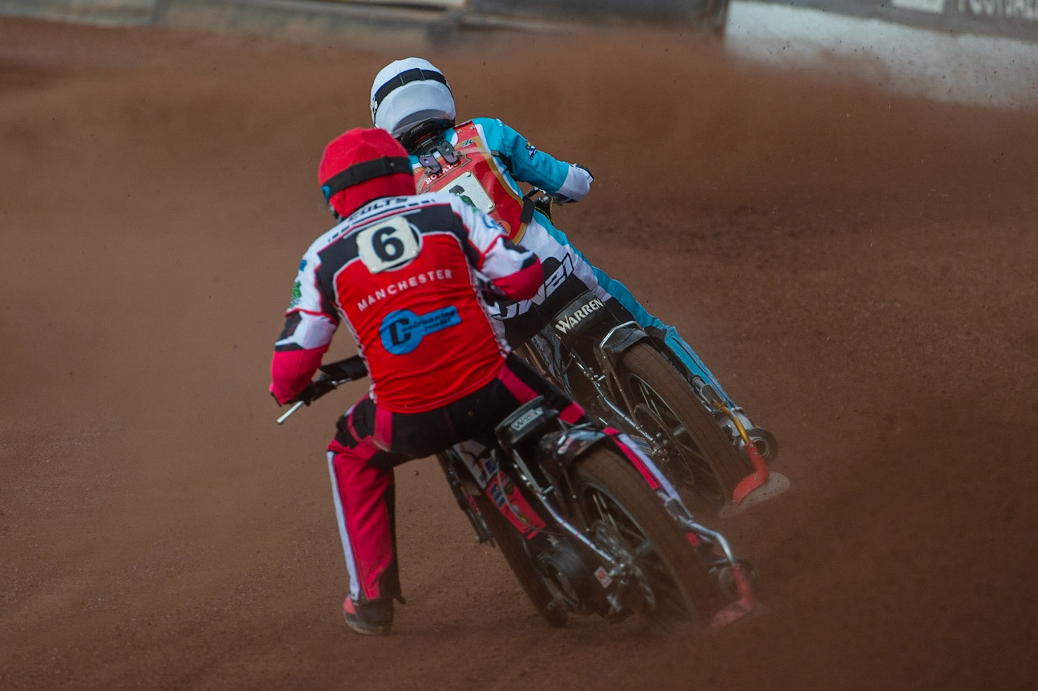 MANCHESTER, UK. JULY 2ND  Sam Woolley  (Red) chases Josh Warren  (White) during the National Development League match between Belle Vue Colts and Kent Royals at the National Speedway Stadium, Manchester on Friday 2nd July 2021. (Credit: Ian Charles | MI News)