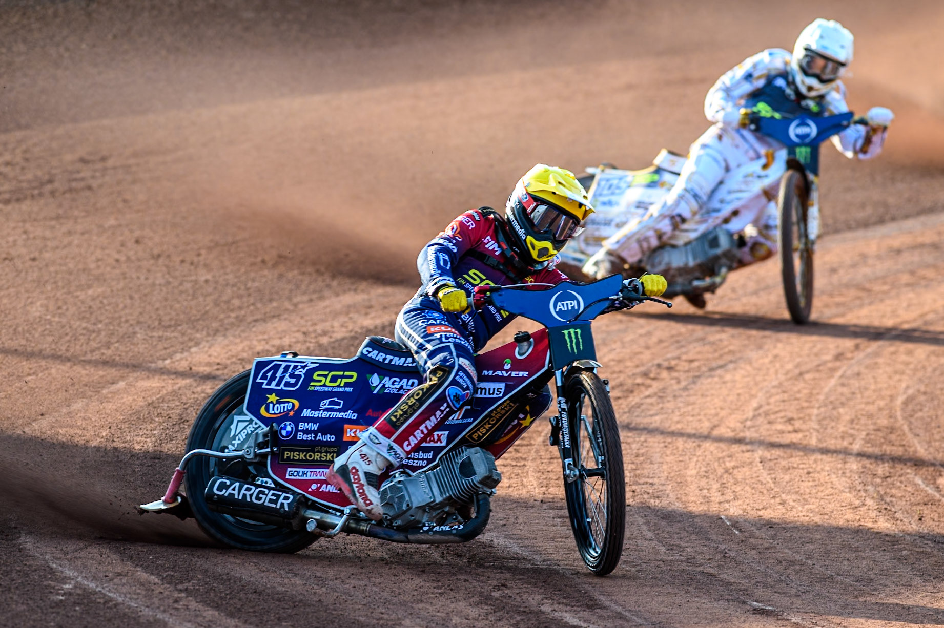 Dominik Kubera (415) of Poland in Yellow leading Anders Thomsen (105) of Denmark in White during the ATPI FIM Speedway Grand Prix Round 5 at the National Speedway Stadium, Manchester, on Saturday 14th June 2025. (Photo: Ian Charles | MI News)