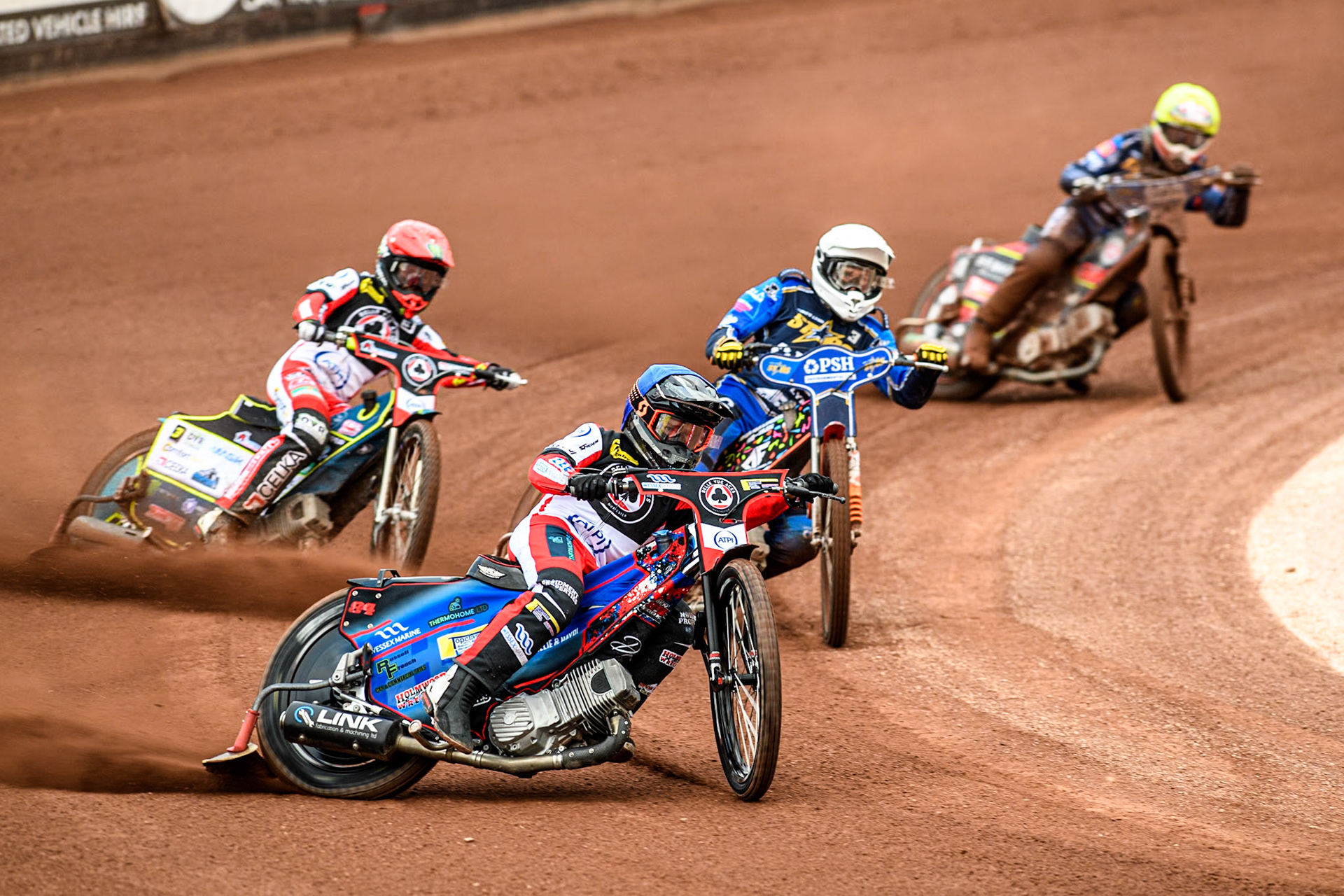 Belle Vue Aces' Ben Cook in Blue and Belle Vue Aces' Jaimon Lidsey in Red leading King Lynn Stars' Niels-Kristian Iversen in White and King Lynn Stars' Michael Palm Toft in Yellow during the Rowe Motor Oil Premiership match between Belle Vue Aces and King's Lynn Stars at the National Speedway Stadium, Manchester on Monday 20th May 2024. (Photo: Ian Charles | MI News)