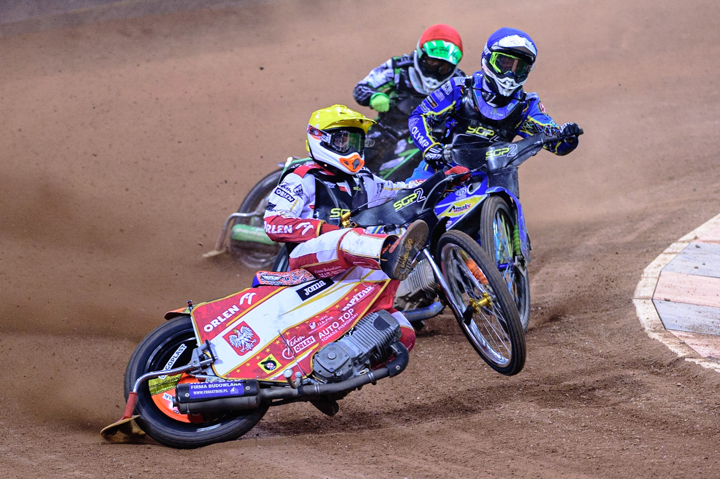 Mateusz Cierniak (Poland) (Yellow)  has a seemingly uncontrollable lift ahead of Petr Chlupac (Czech Republic)  (Blue) and Mateusz Swidnicki (Poland)  (Red) during the FIM  Speedway Grand Prix  2 of Great Britain at the Principality Stadium, Cardiff on Sunday 14th August 2022. (Credit: Ian Charles | MI News)